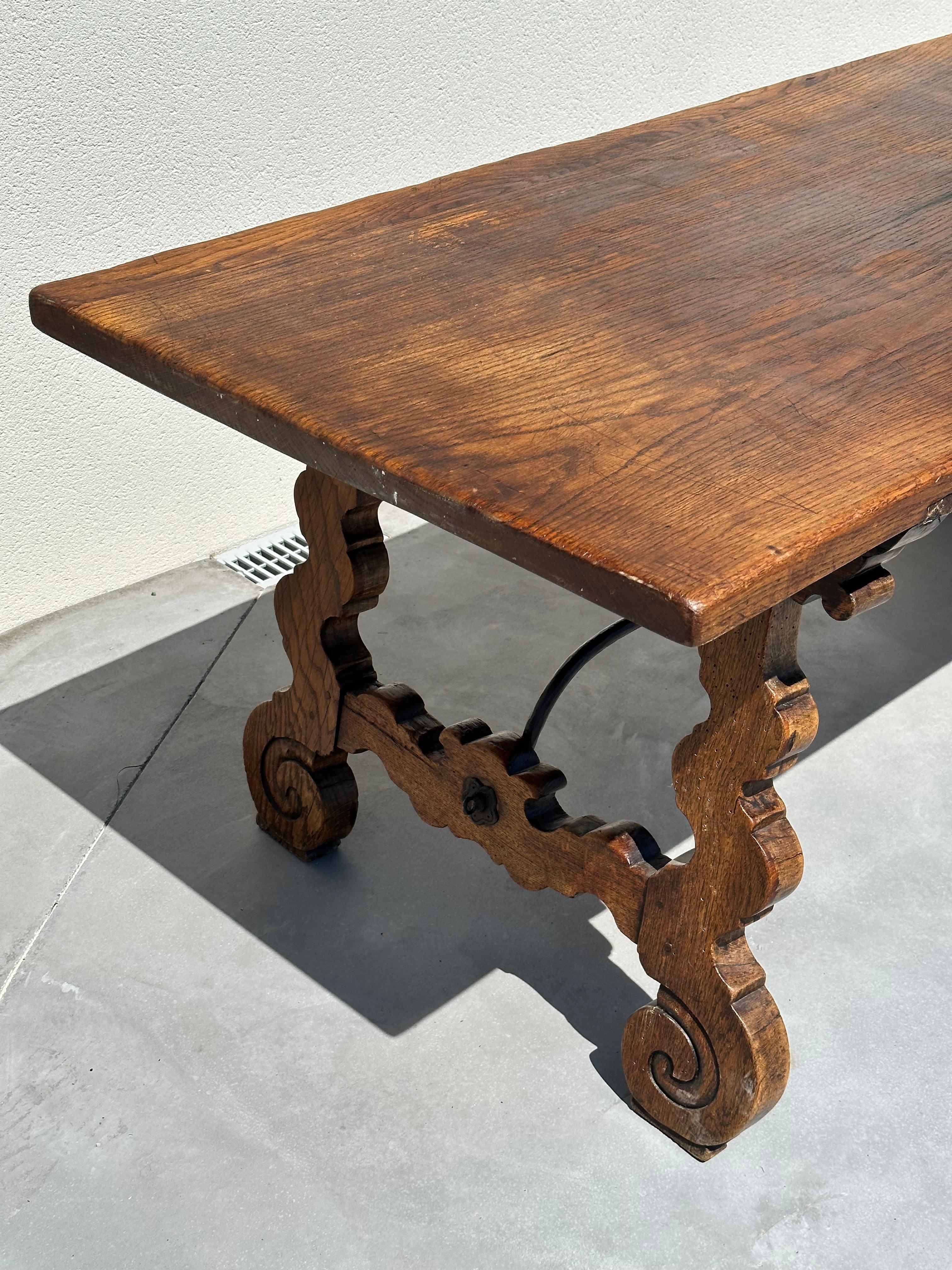 Hand-Crafted Refectory regionalist table, solid walnut and wrought iron. 19th century, Spain For Sale