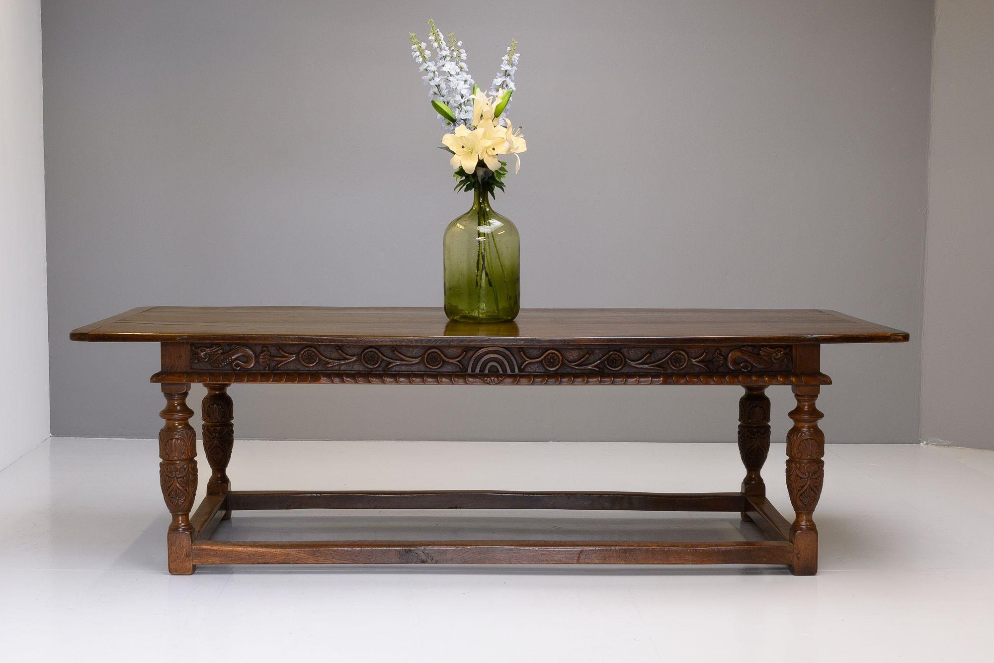 Large oak refectory table with carved base. The table has been stripped and polished and is in great condition.