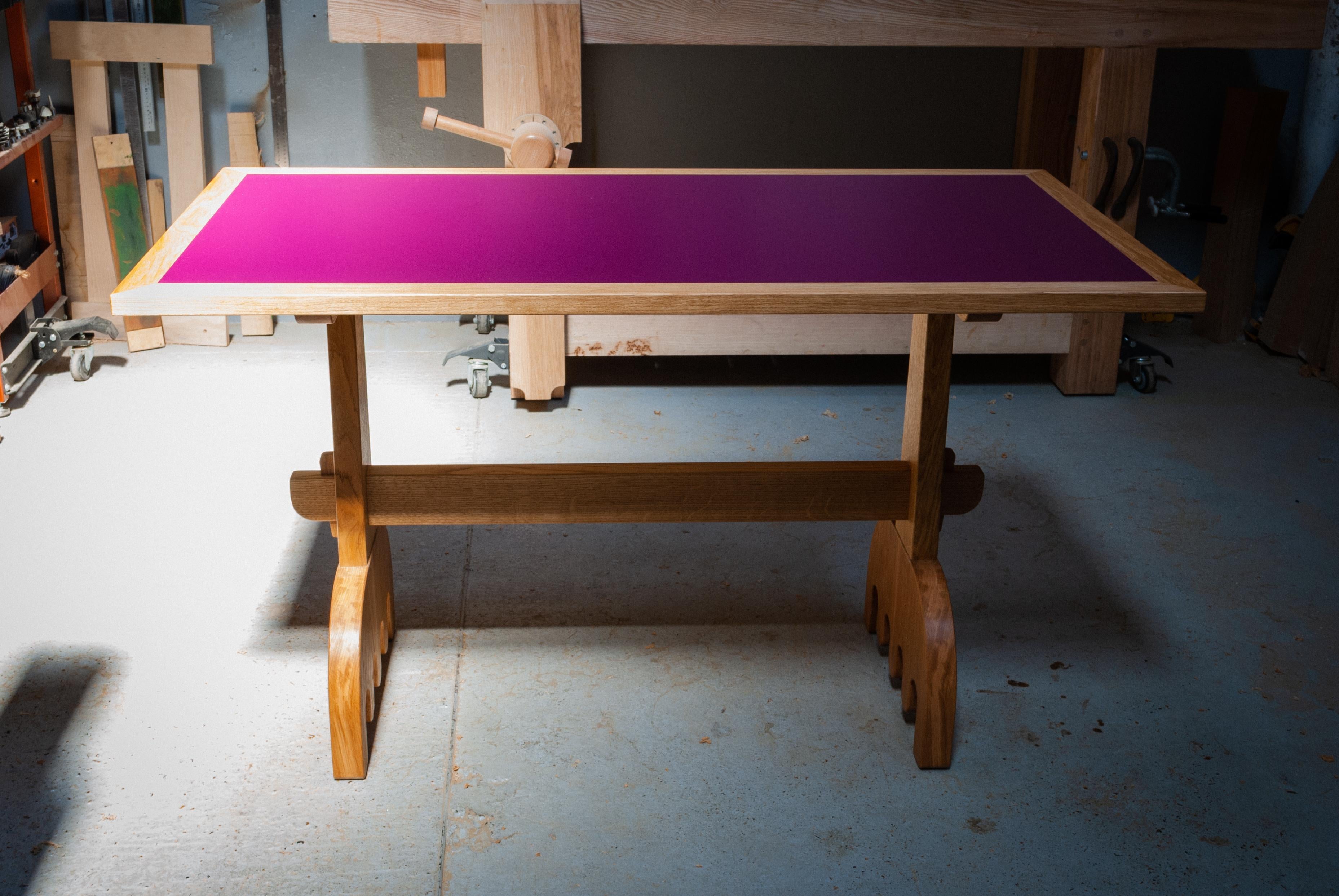 Solid English Oak Dining Table with wedged mortice and tenon joints on the legs and wiggly feet. Based on traditional construction, with a chunkier and playful twist and colourful pink Formica top.

This table is made from solid timber, intelligent