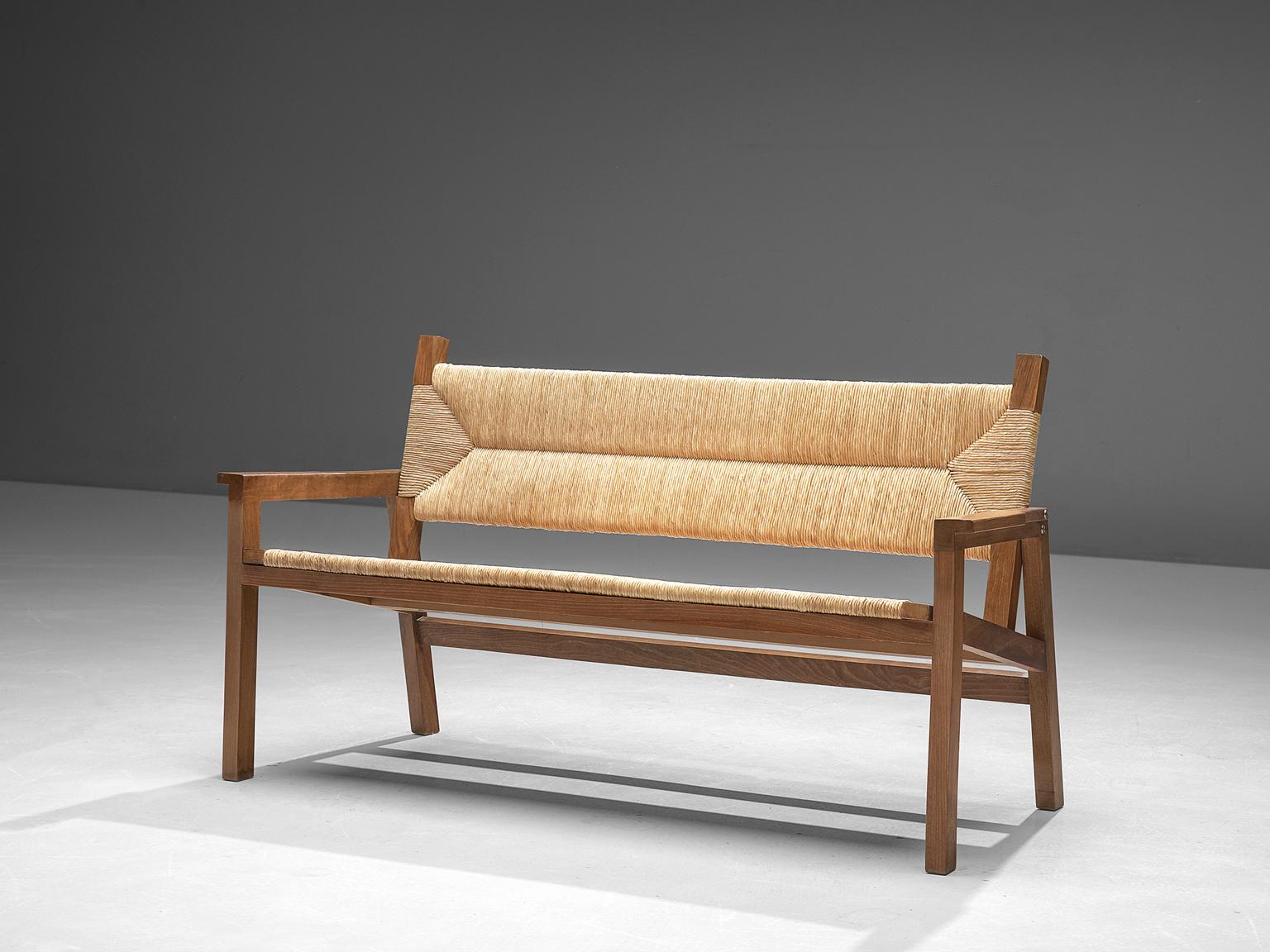 Muebles Execo, bench, cane and walnut, Spain, 1970s

This midcentury bench is made of walnut and cane. The design is very simplistic and modest, yet refined and elegant details. Such as the armrests, that have a sculptural touch. The seat and