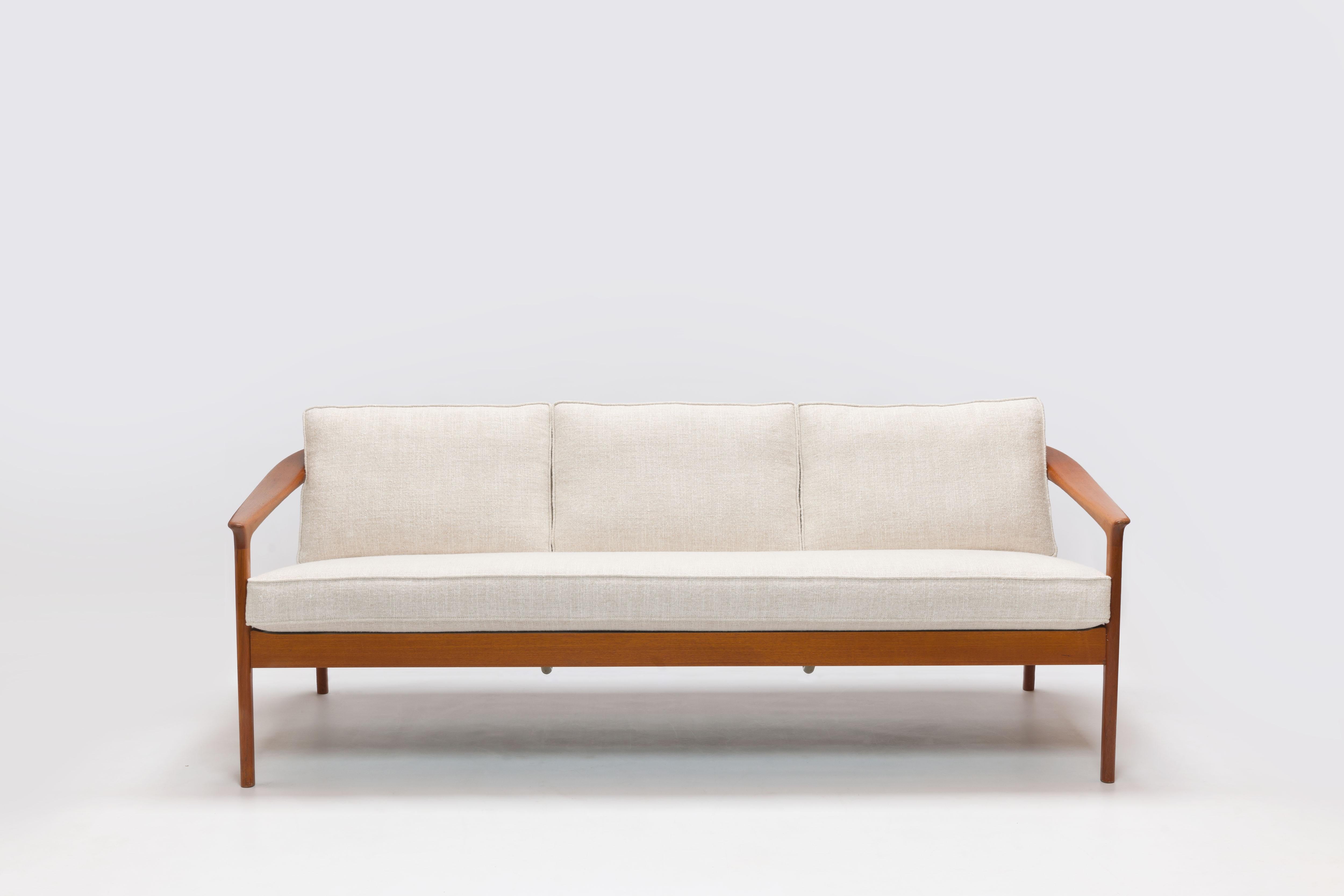 Exceptionally refined 3-seat sofa by Swedish designer Folke Ohlsson for Bodafors Sweden in all new neutral Pierre Frey (high end fabric) upholstery with all new cushions.
This sofa design from 1962 is celebrated for its refined lines and