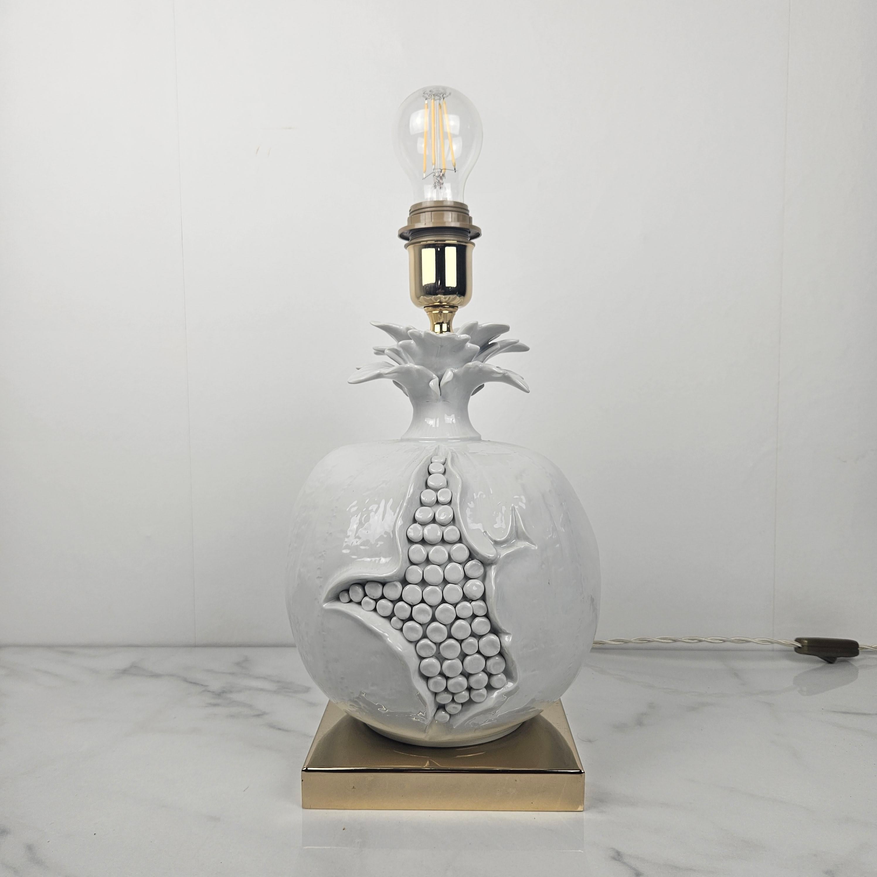 An exceptional example of Italian decorative lighting from the early 1970s, this sculptural ceramic table lamp showcases the elegance, imagination, and craftsmanship characteristic of Italian design of the period. The lamp’s rounded body is rendered