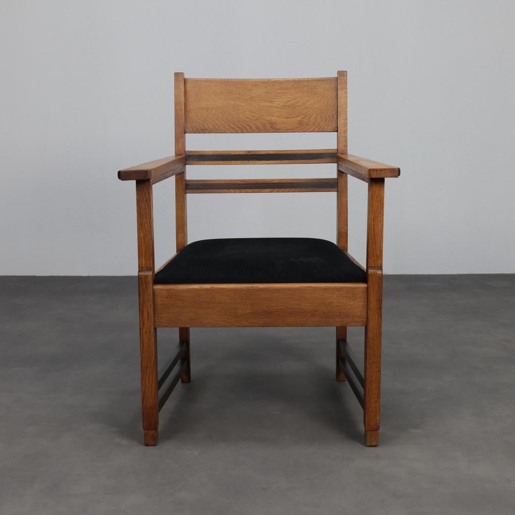 This elegant pair of Art Deco armchairs from the 1930s showcases the understated sophistication of the period. Crafted in oak with refined Coromandel wood accents, the chairs feature strong geometric lines and a clear architectural structure