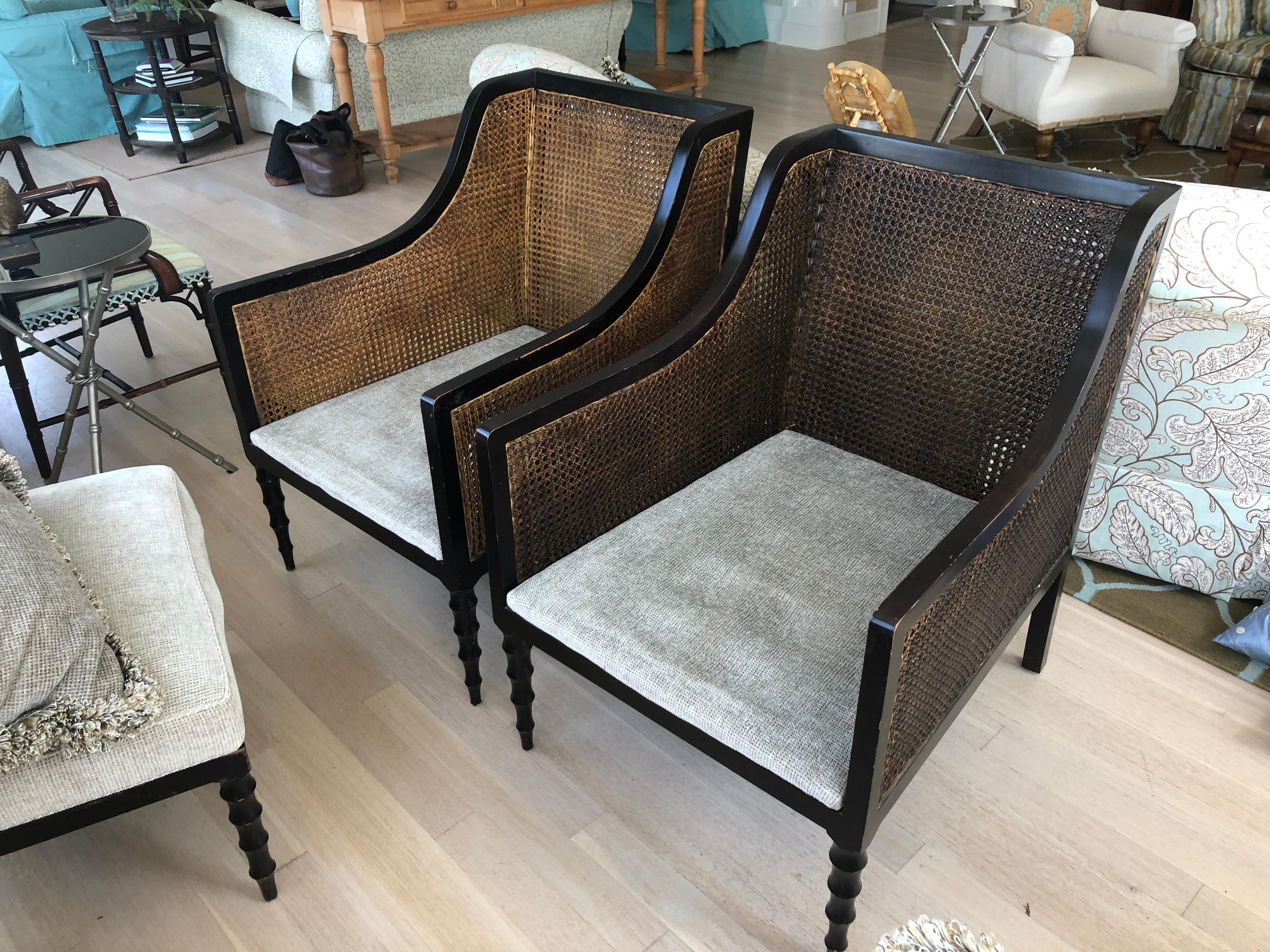 Refined Pair of Ebonized Double Caned Upholstered Club Chairs and Ottomans 1