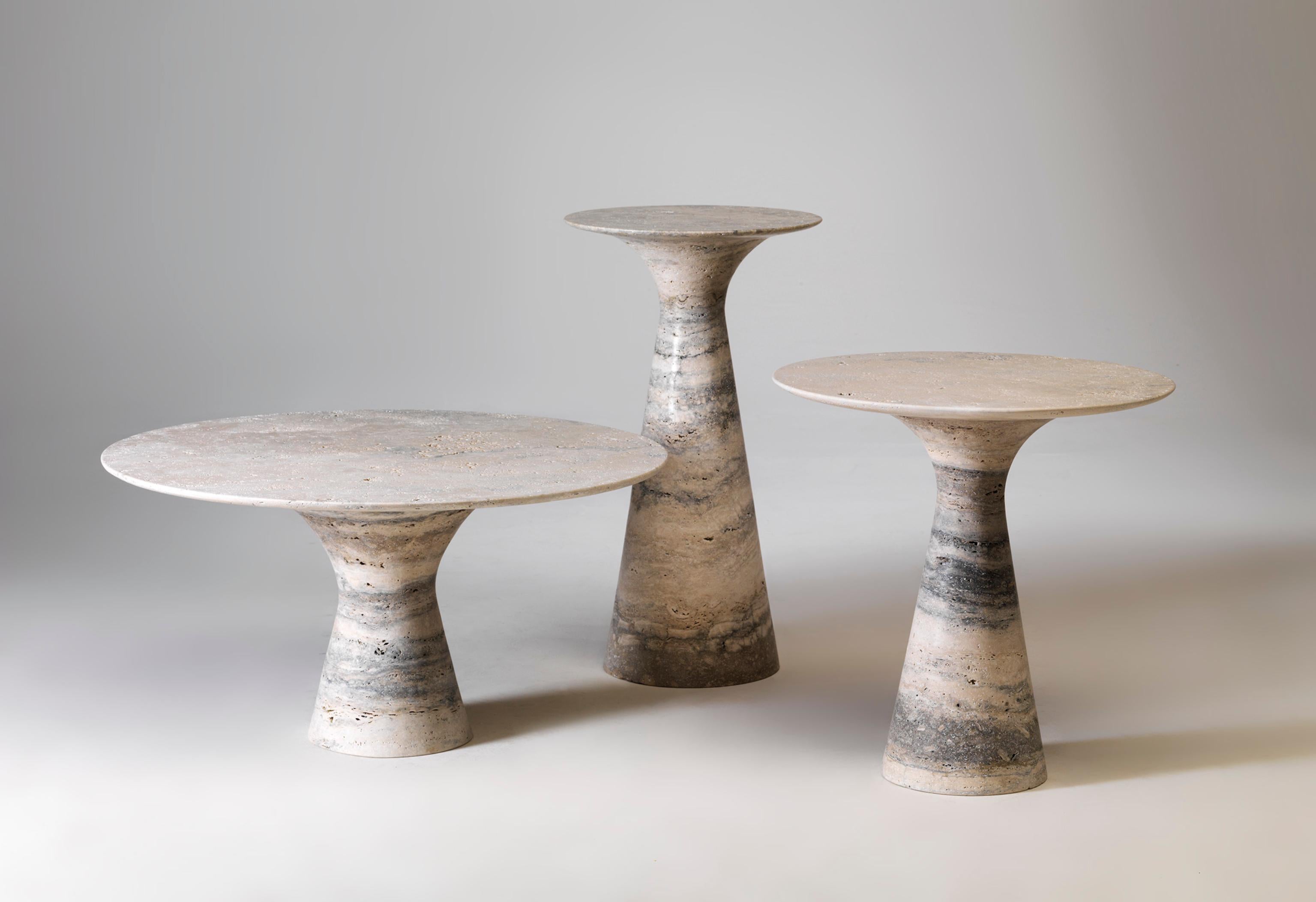 Refined Set of 2 Travertino silver contemporary marble side tables
Measures: Tall 62 x 45 x 45 cm
Short 36 x 80 x 80 cm

Angelo is the essence of a round table in natural stone, a sculptural shape in robust material with elegant lines and