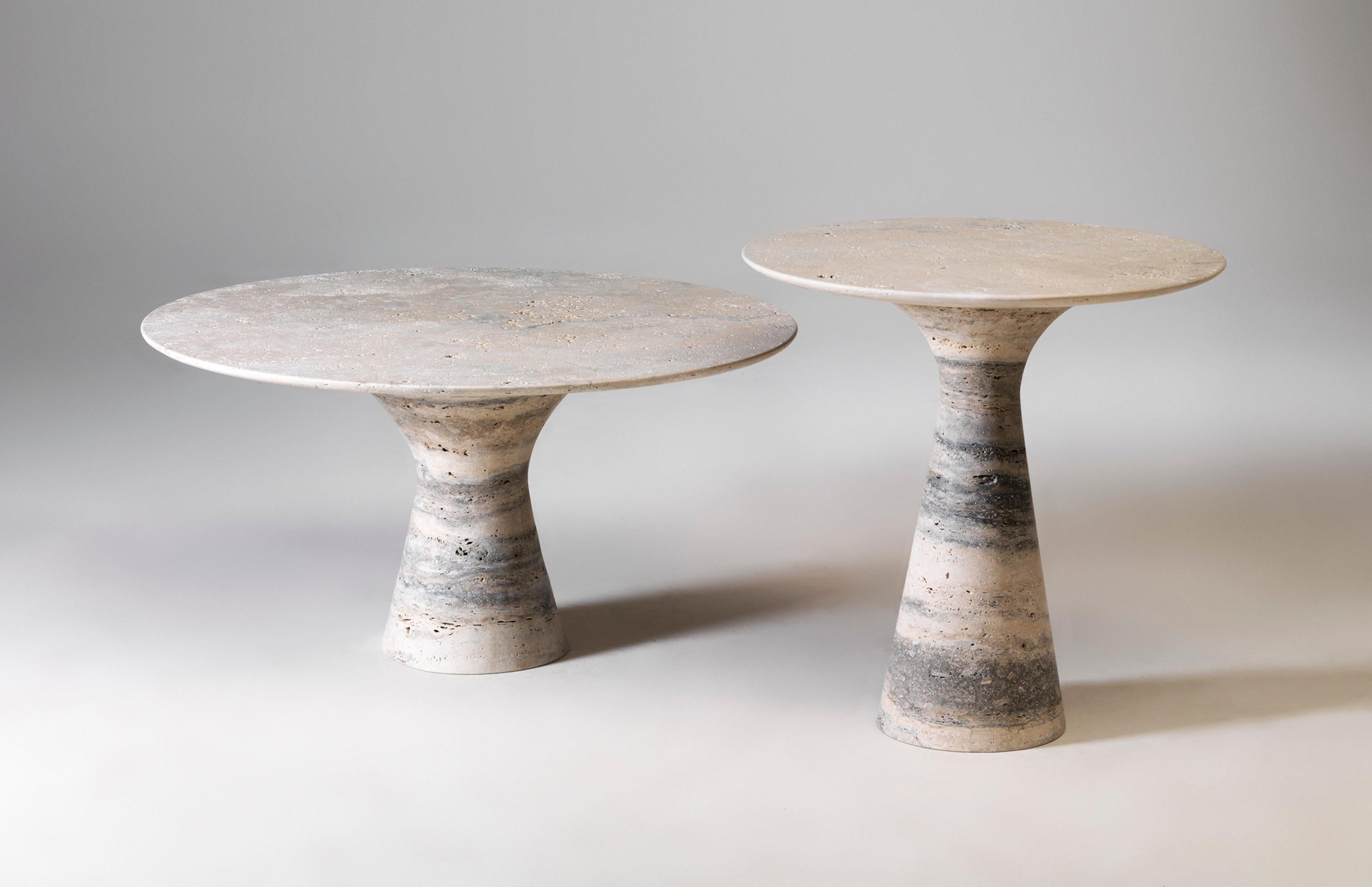 Refined Set of 3 Travertino silver contemporary marble side tables
Measures: Tall: 62 x 45 x 45 cm
Medium: 48 x 55 x 55 cm
Short: 36 x 80 x 80 cm
Materials: Travertino Silver marble

Angelo is the essence of a round table in natural stone, a