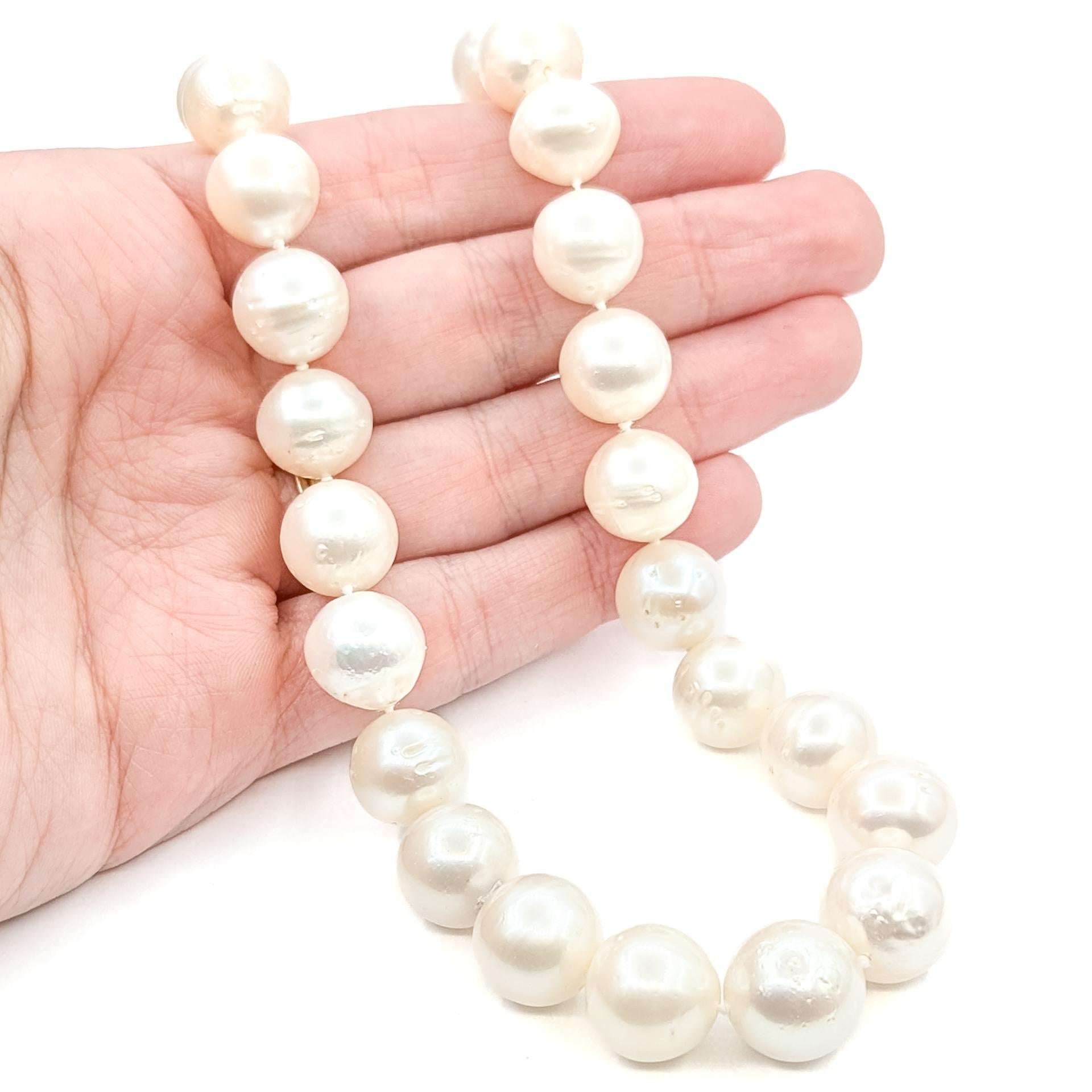This elegant necklace is crafted in 14k white gold and features luminous South Sea pearls in a classic strand design. Each pearl displays a soft, creamy luster with beautiful natural texture, creating a timeless and sophisticated look.

Measuring 18