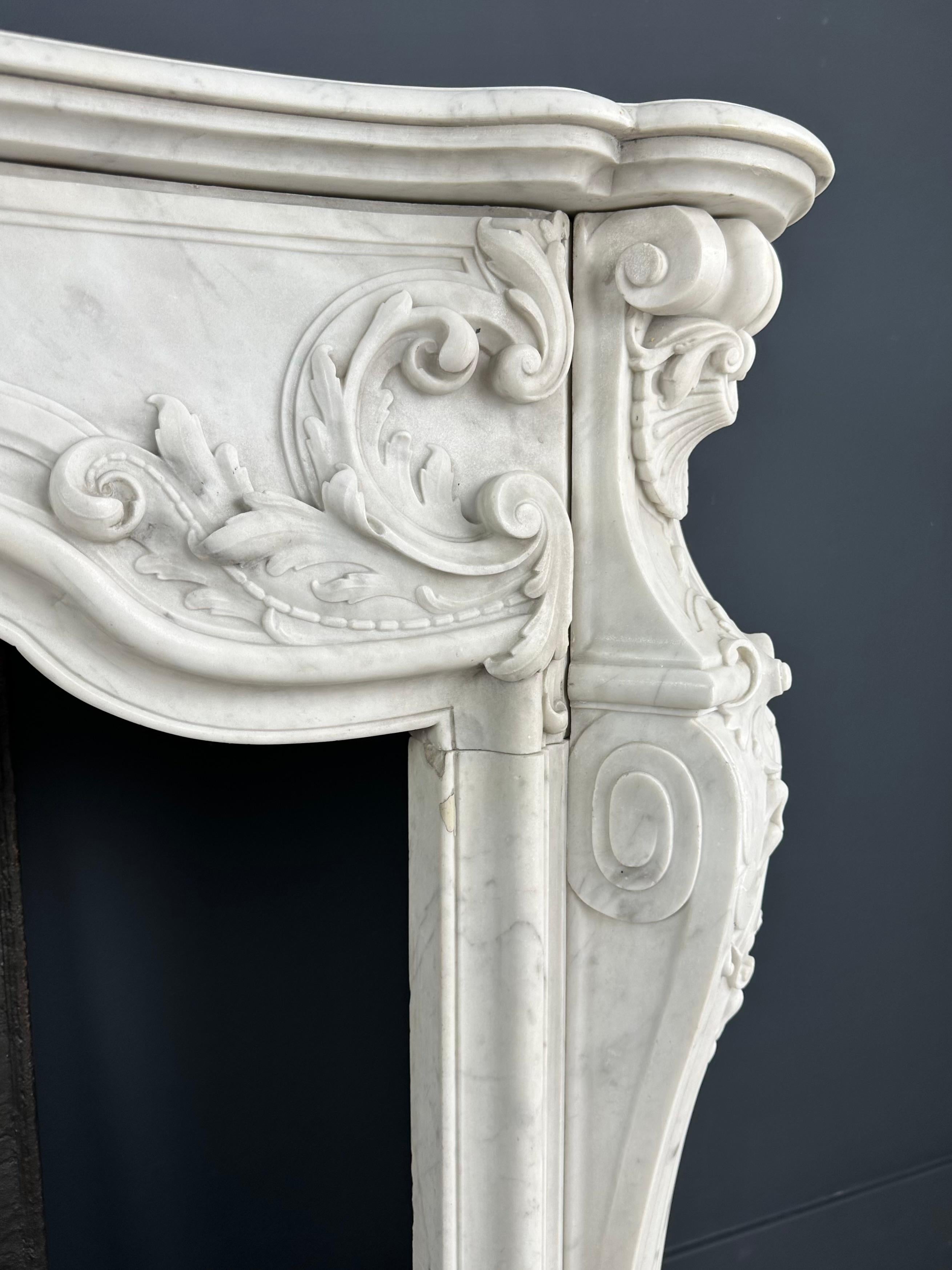 Refined Splendor: Exclusive Antique Louis XV Carrara White Marble Fireplace For Sale 4