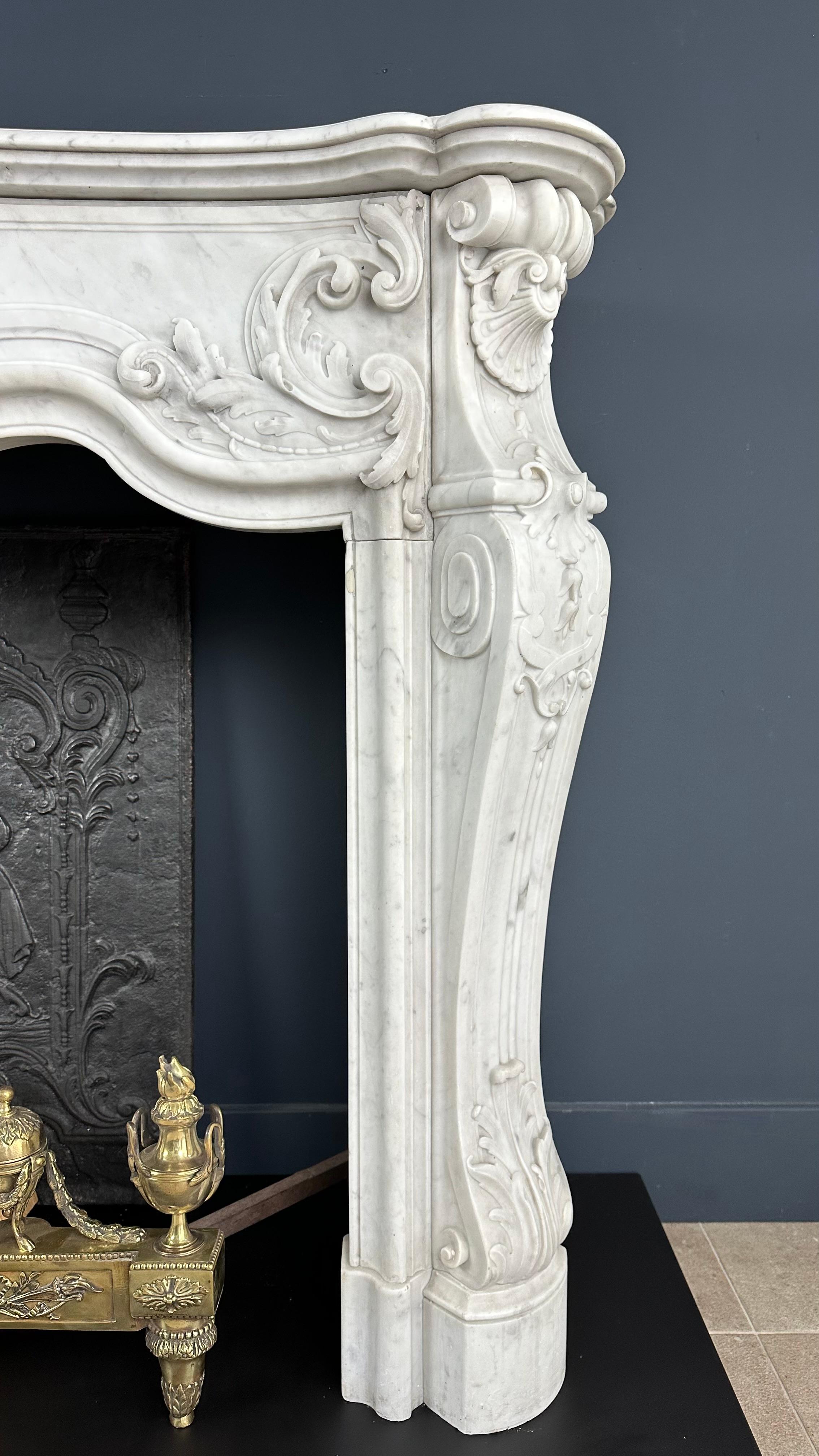 Refined Splendor: Exclusive Antique Louis XV Carrara White Marble Fireplace For Sale 8