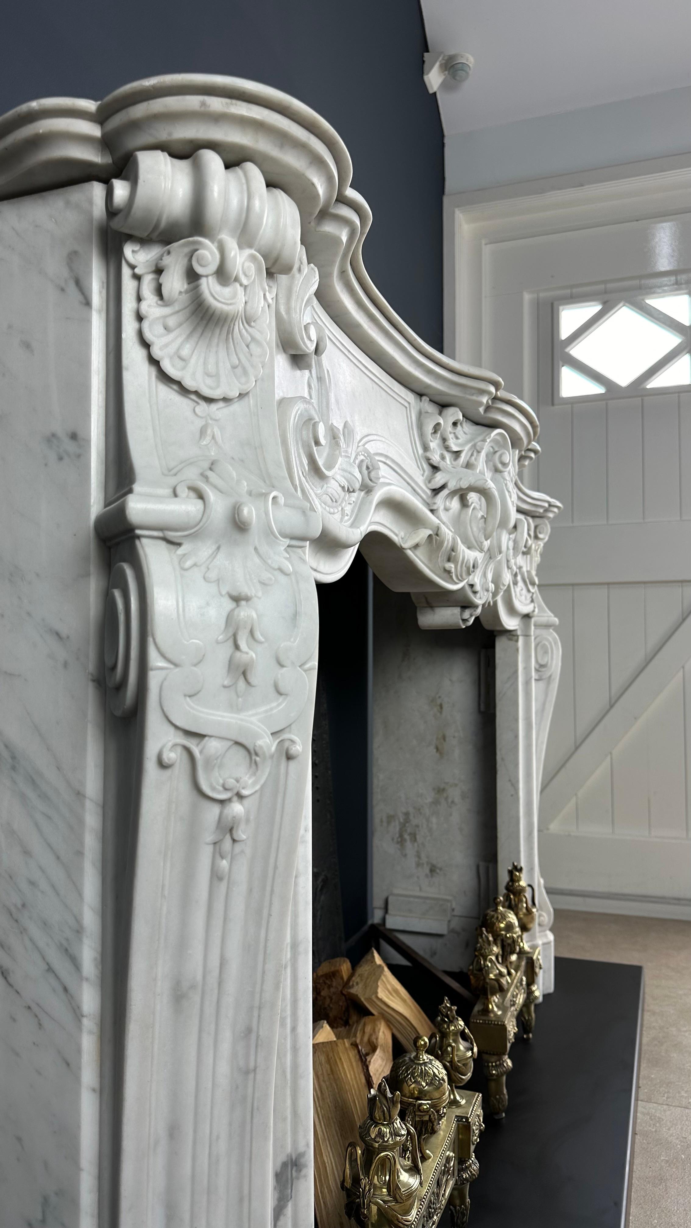 Masterful Elegance: Rare Antique Louis XV Carrara White Marble Fireplace

It's an exceptional privilege to witness a treasure like this emerge on the market, and I am proud to present this extraordinary fireplace as a valuable addition to any