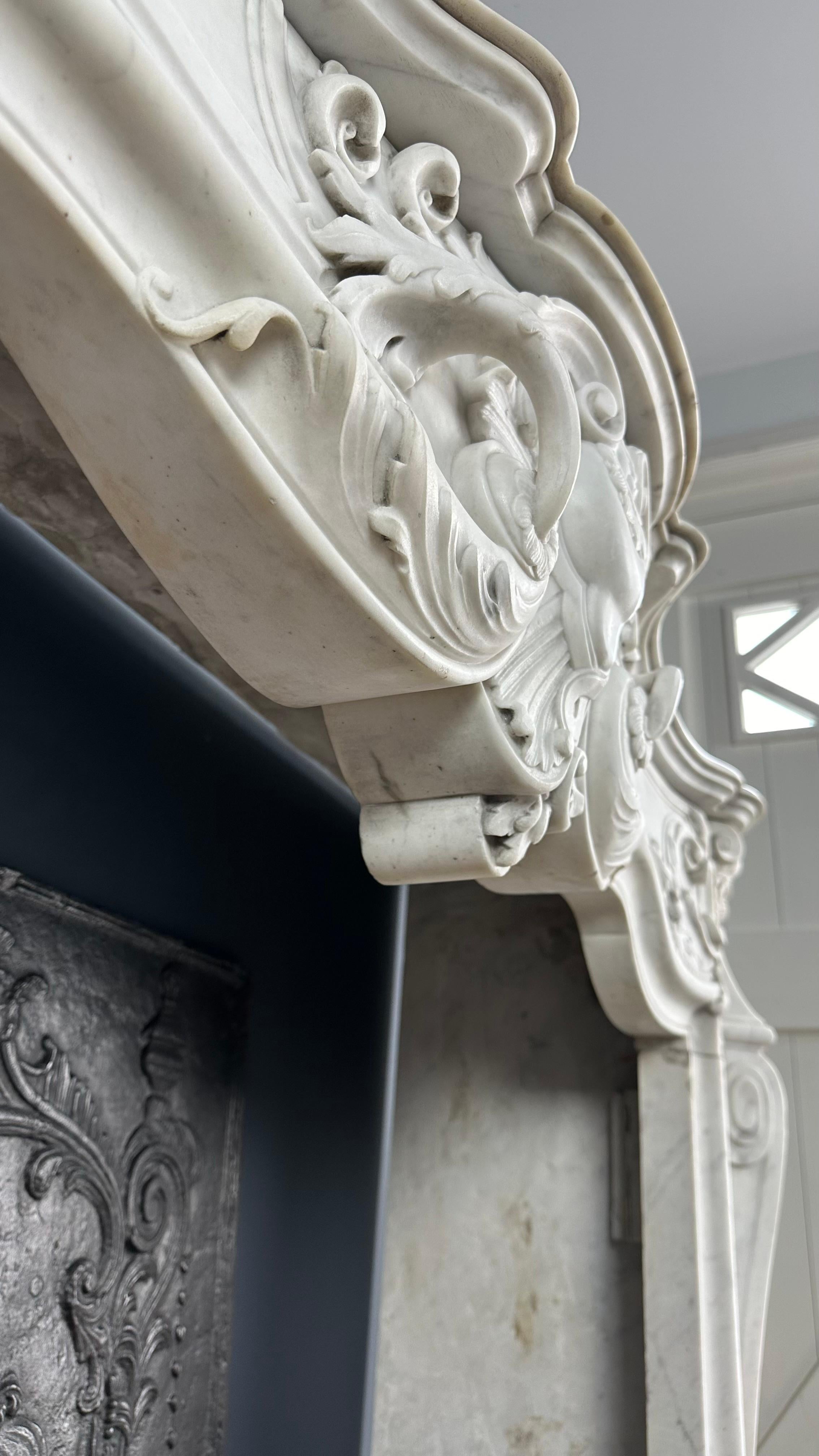 French Refined Splendor: Exclusive Antique Louis XV Carrara White Marble Fireplace For Sale