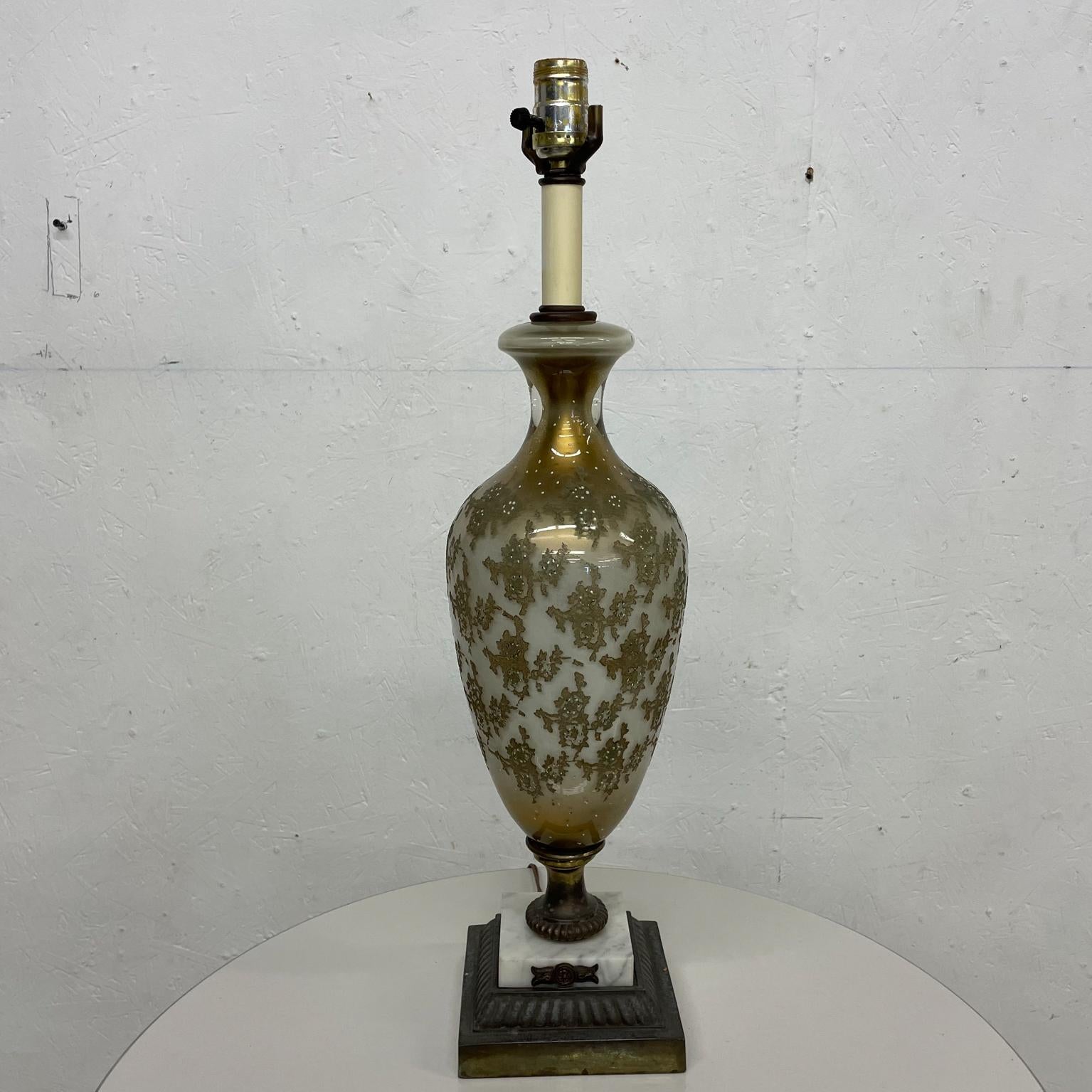 Lamp
Exquisite art glass single table Lamp attributed to Murano vintage Italy 1950s
Refined Style of Murano brass gold marble art glass 
Unmarked
Measures: 24.5 to base of socket x 6 diameter at widest point
Preowned original vintage unrestored