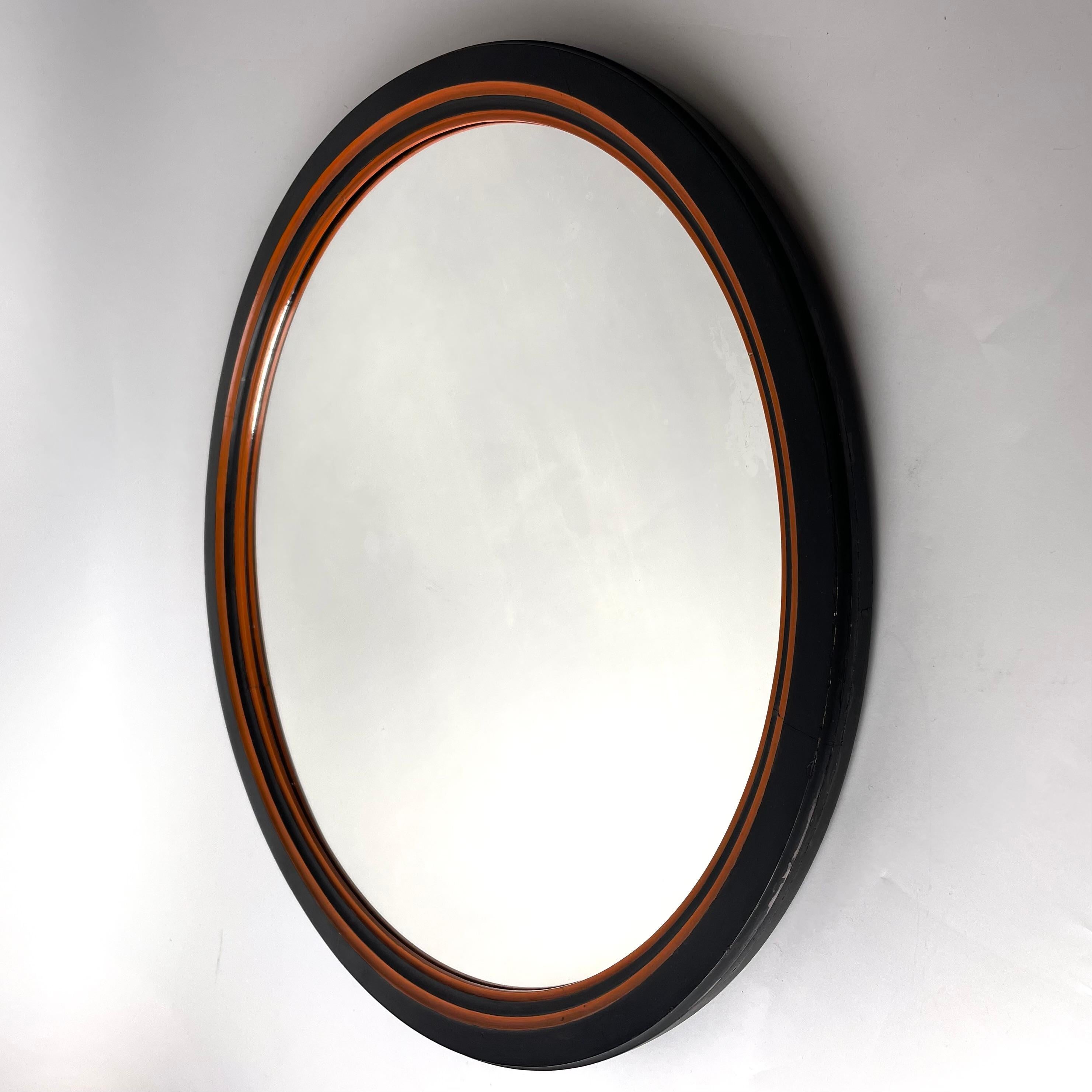 A Refined Art Deco/Swedish Grace Wall Mirror in Black and Orange Lacquered Birch, marked Wiholm Stockholm on back. Manufactured in Sweden during the interwar period (1920s-1930s) during the prominent Swedish Grace era of design. 

A beautifully