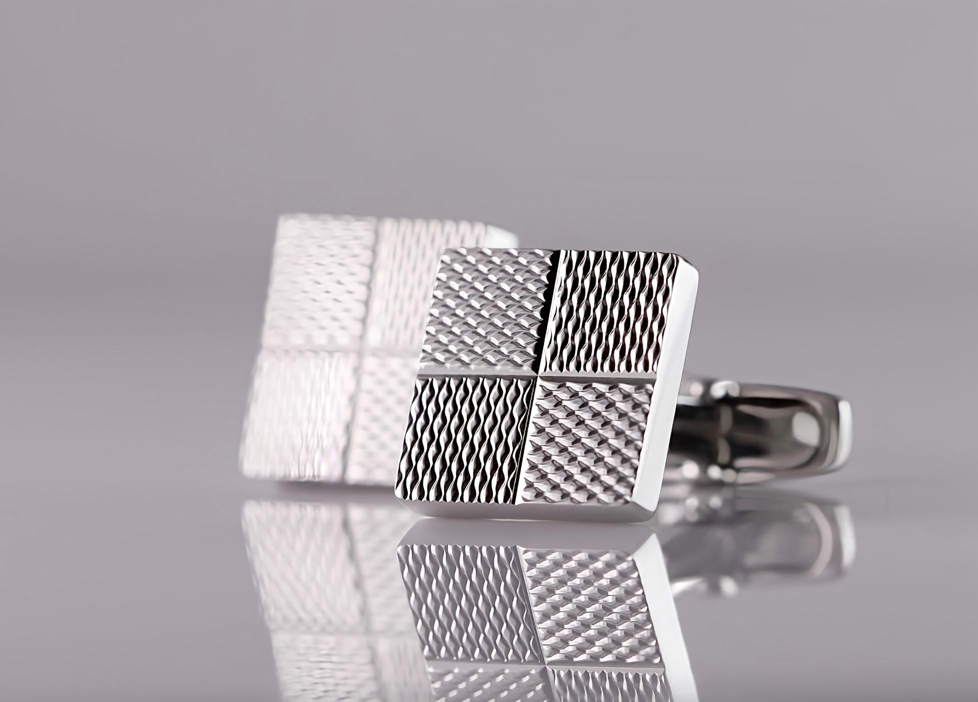 In the intricate world of men's accessories, cufflinks stand as a testament to both style and refinement. These cufflinks, handcrafted in 18kt white gold, exude an aura of understated elegance. 

The artisan's deft touch creates a mesmerizing