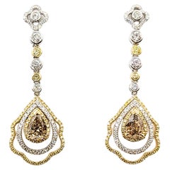 Raffinati orecchini pendenti in oro bicolore 14 carati