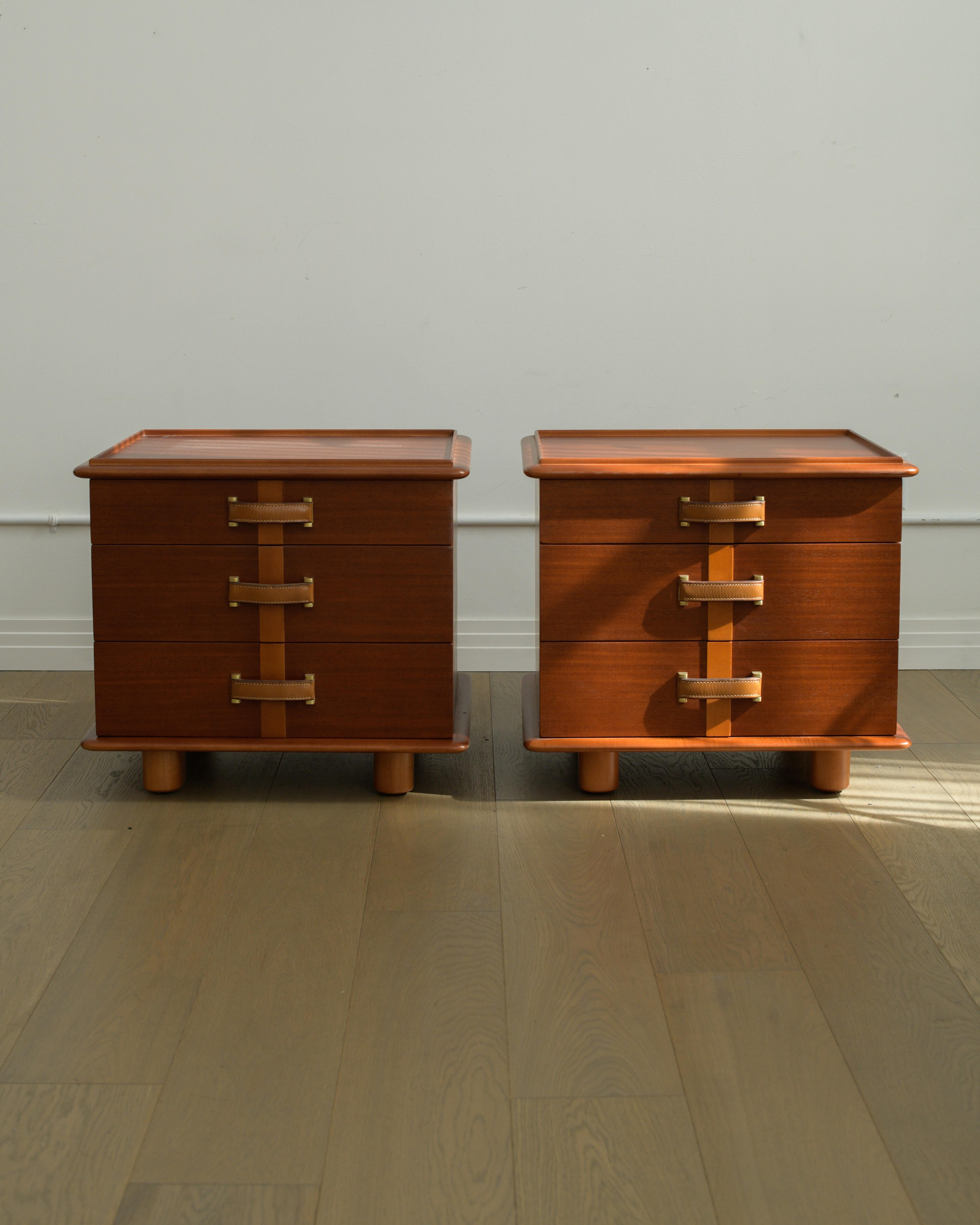 
Rare and important 1945 Paul Frankl Station Wagon Nightstands/end tables for Johnson Furniture Company  USA. 

Made from mahogany, birch, leather, maple, and brass - each nightstand/end table features three drawers with beautiful leather pulls.