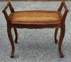 Refinished French Provincial Louis XV style walnut bench with a caned seat