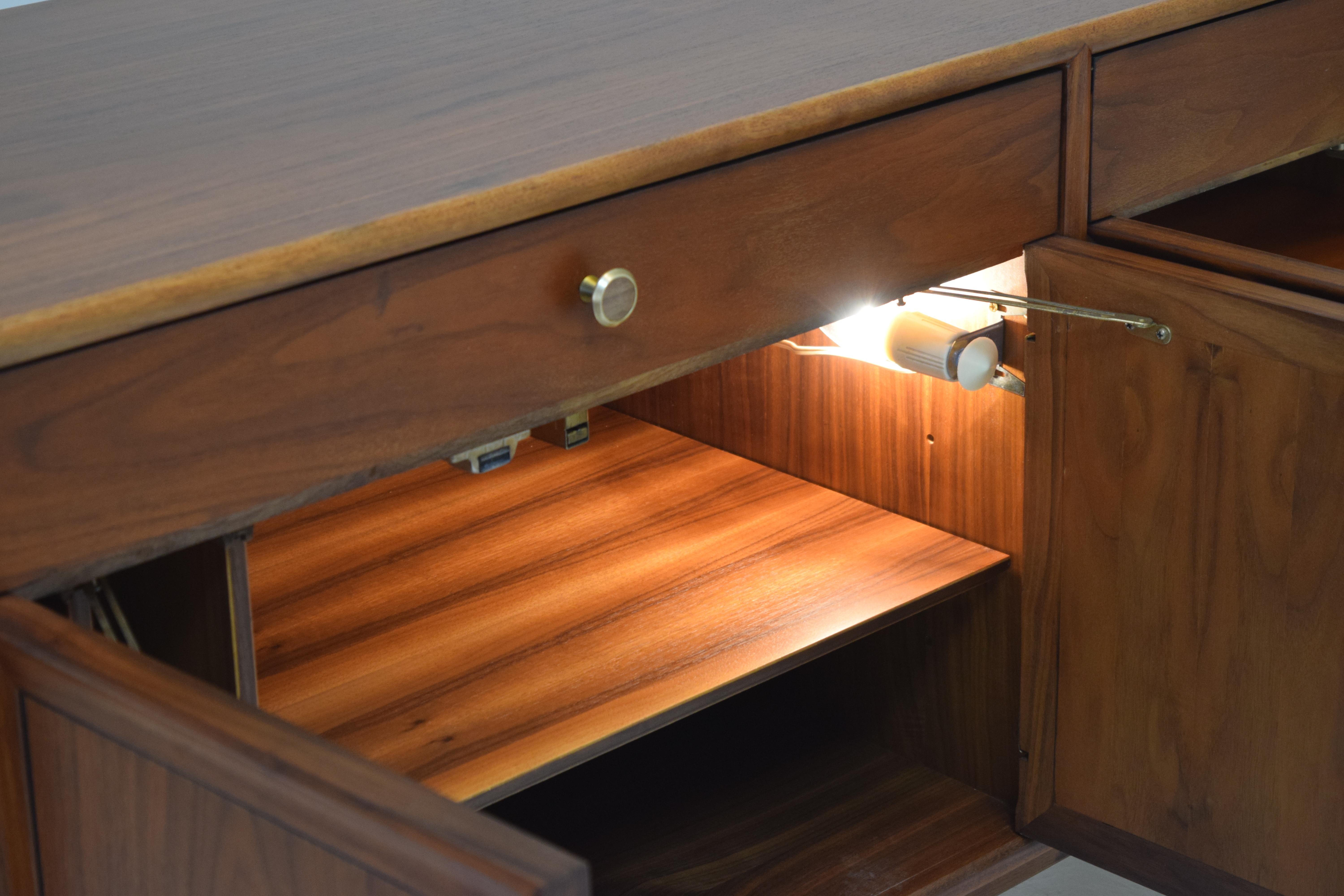 The case of this cabinet has been refinished with a specialized lacquer (Krystal by M.L. Campbells) that provides unprecedented protection from abrasion, hold and cold water and even alcohol. Measures: 60