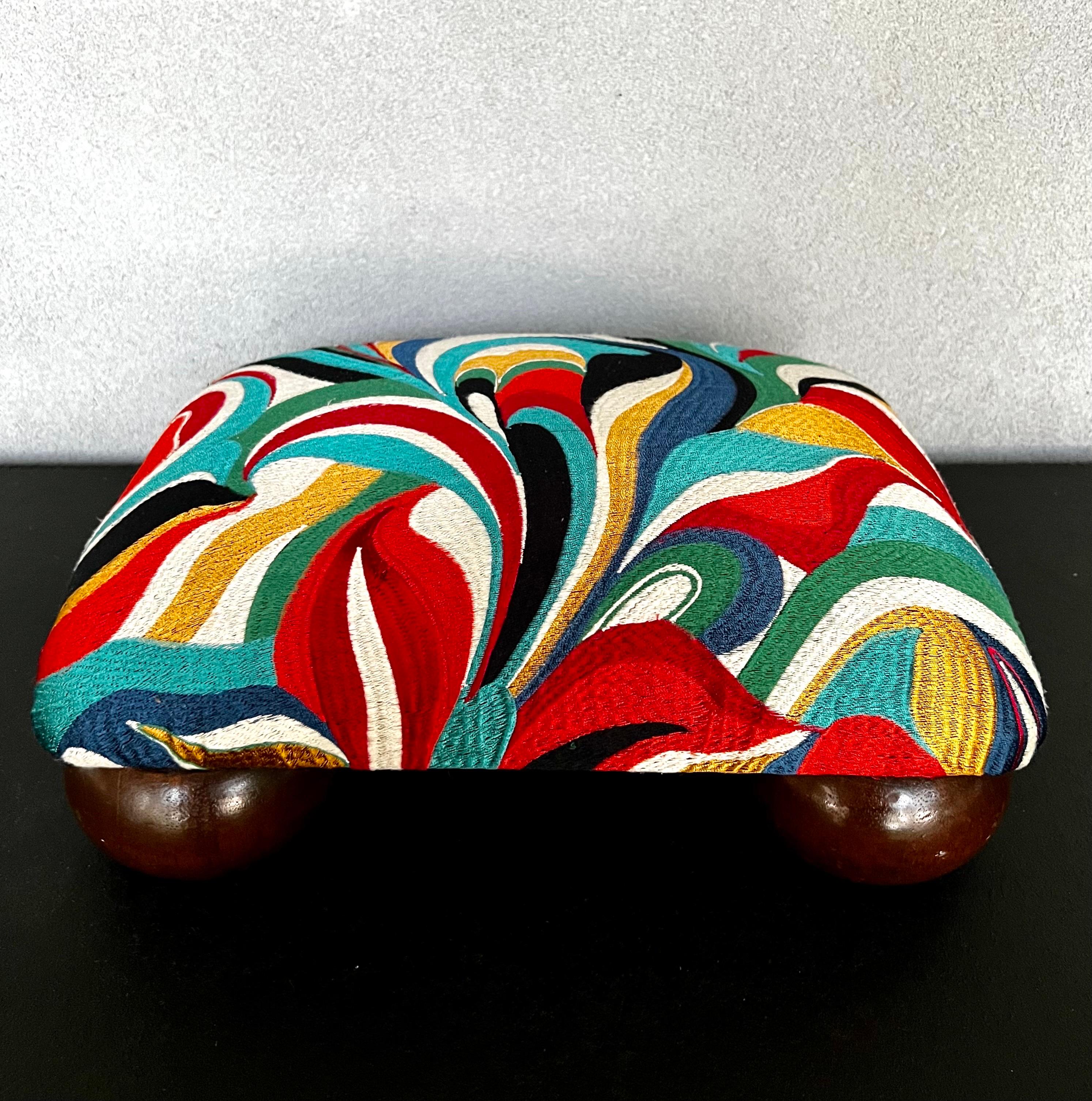 Stunning small Mid-Century Modern footstool that has been fully refinished including new foam and padding, this vibrant multicolor abstract embroidered fabric is the pop of color needed in any room 
This small footstool would be the perfect addition