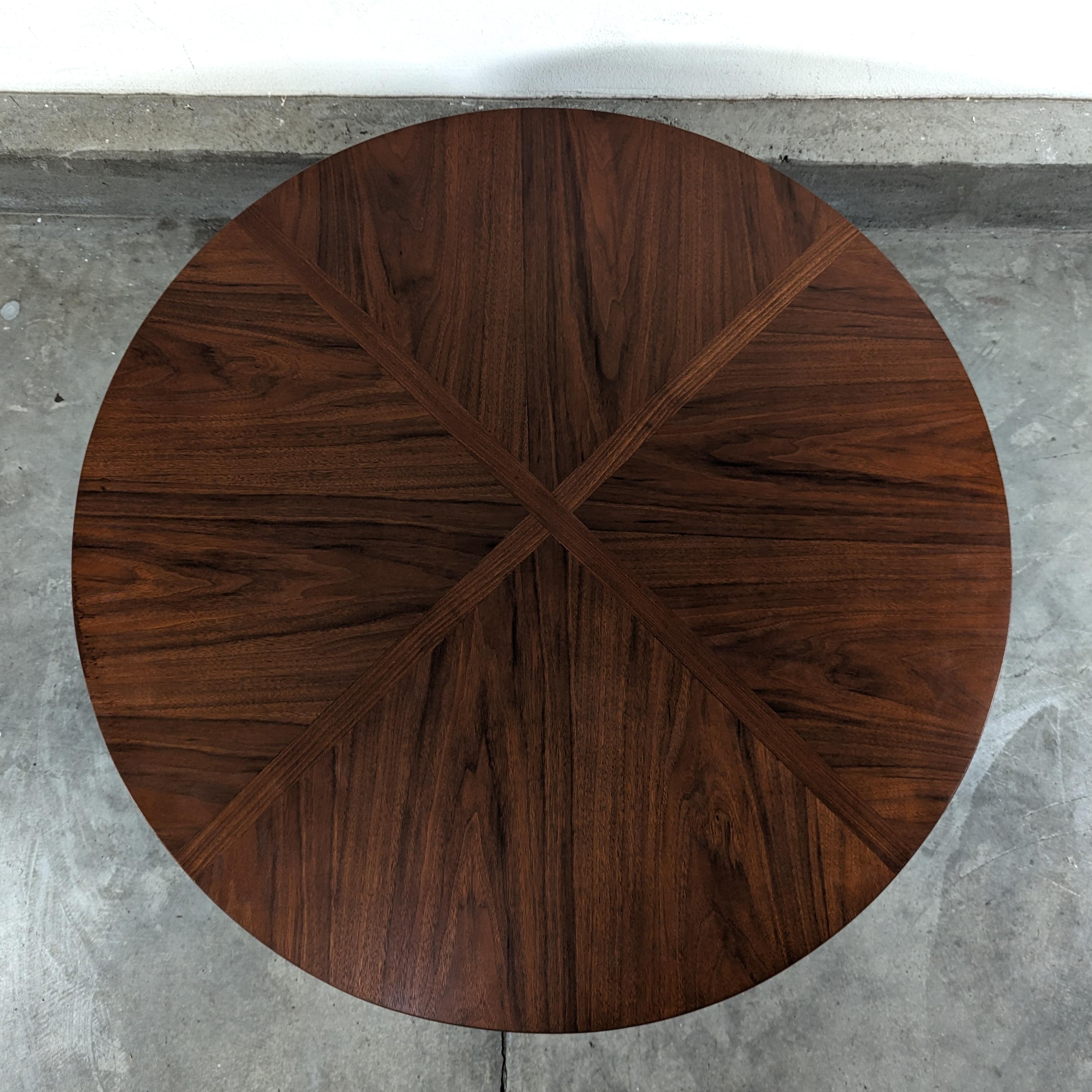 Elevate your living space with this exquisite vintage mid-century modern walnut table that exudes timeless elegance and sophistication. This stunning piece is in overall excellent condition, having been lovingly refinished to showcase its natural