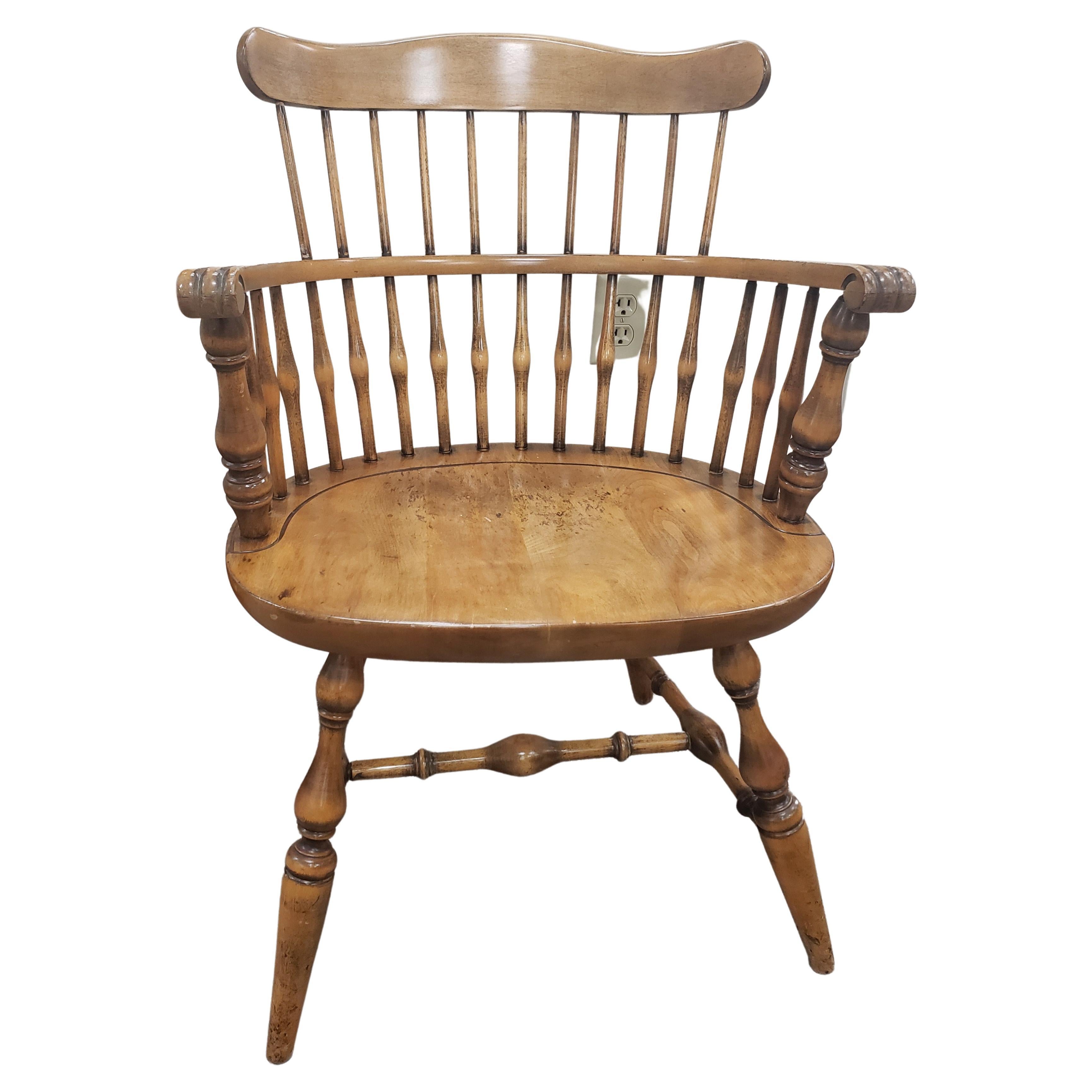 A newly refinished set of maple comb back Windsor armchairs by Nichols and Stone. This set is in very good condition as it has been professionally refinished and keeping its vintage look and feel. 5 matching side chairs available in our inventory,