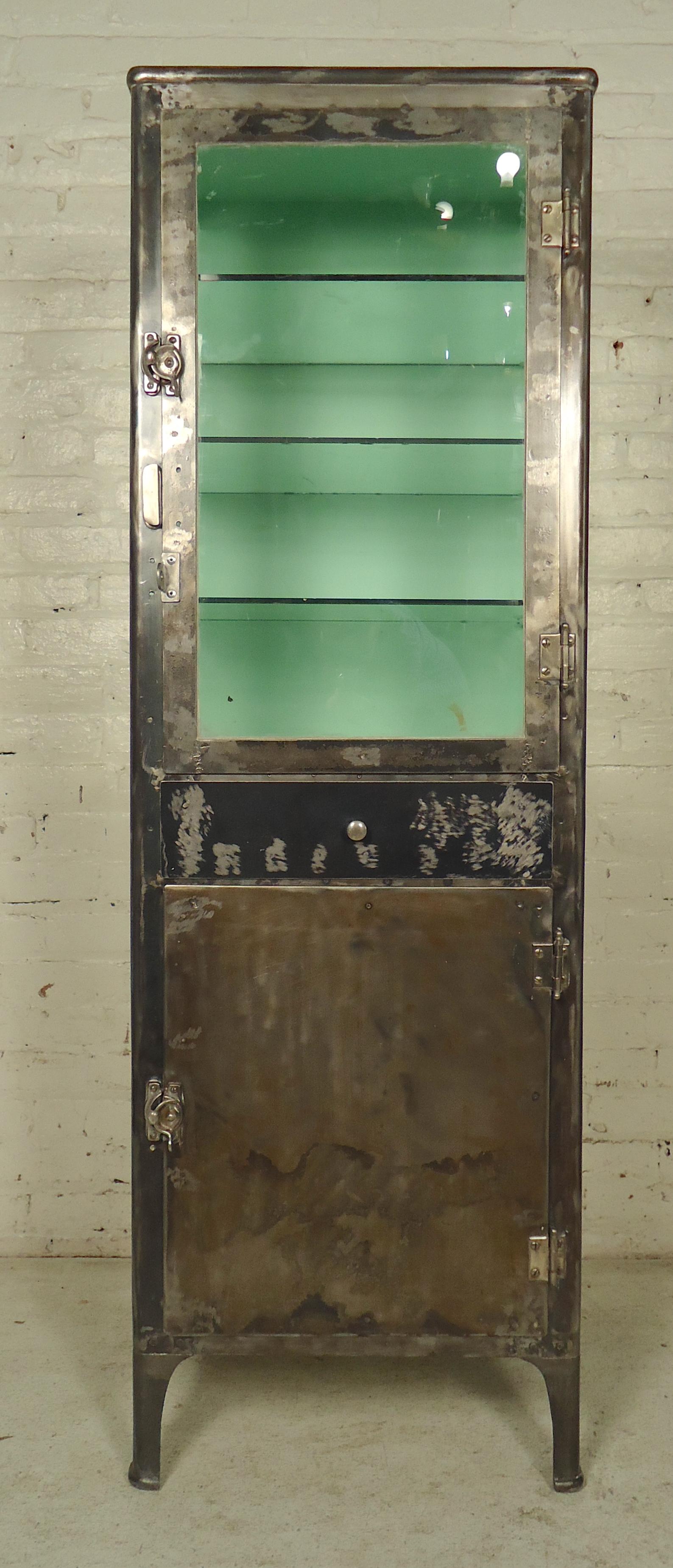Metal display cabinet with three glass sides and glass shelves. Restored to a bare metal style finish.
Great for kitchen or bathroom storage.
(Please confirm item location - NY or NJ - with dealer).
  
