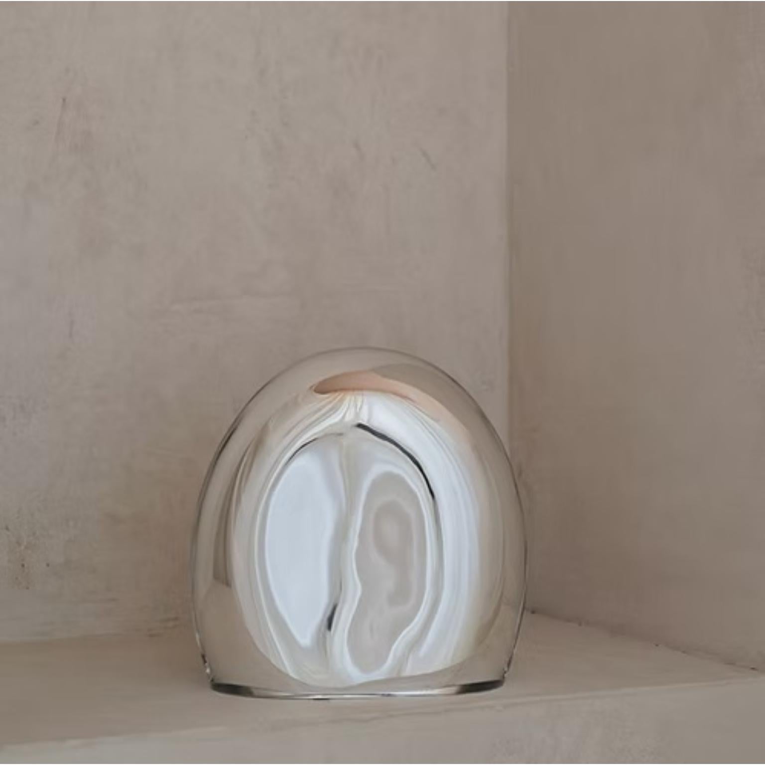 Reflecting M Standing Mirror Sculpture by Milena Kling
Unique Piece.
Dimensions: Ø 19 x 20cm.
Materials: Mouth-blown mirror.

Each hanging or standing Mirror Sculpture is one of a kind, mouth-
blown by me and artisan glass masters. The wall