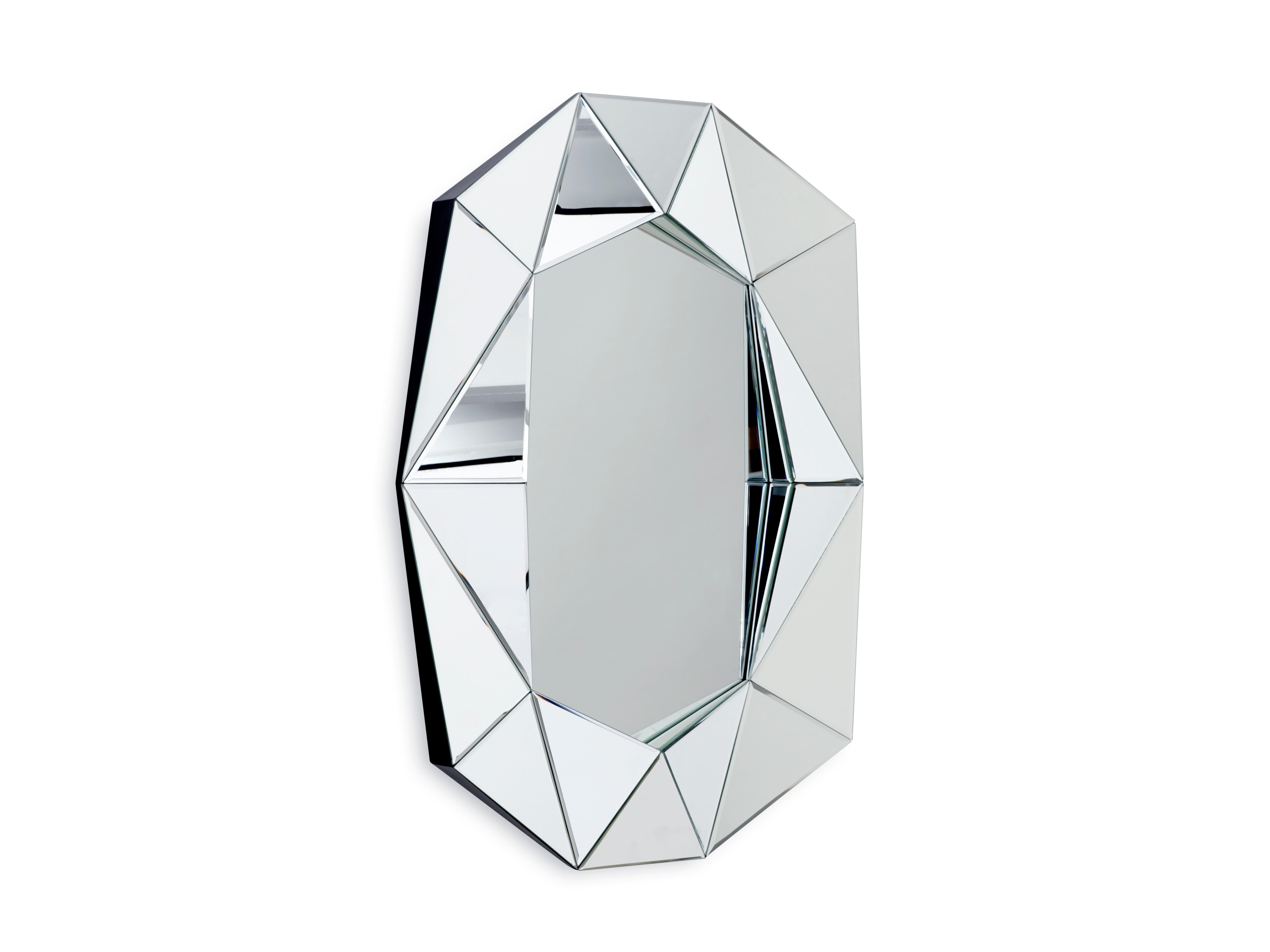 The Diamond large mirror illustrates a perfect combination of function and art. This unique mirror is inspired by the dazzling Art Deco era with its striking diamond shaped wedges, and yet it still manages to invoke a classic feel when placed in the