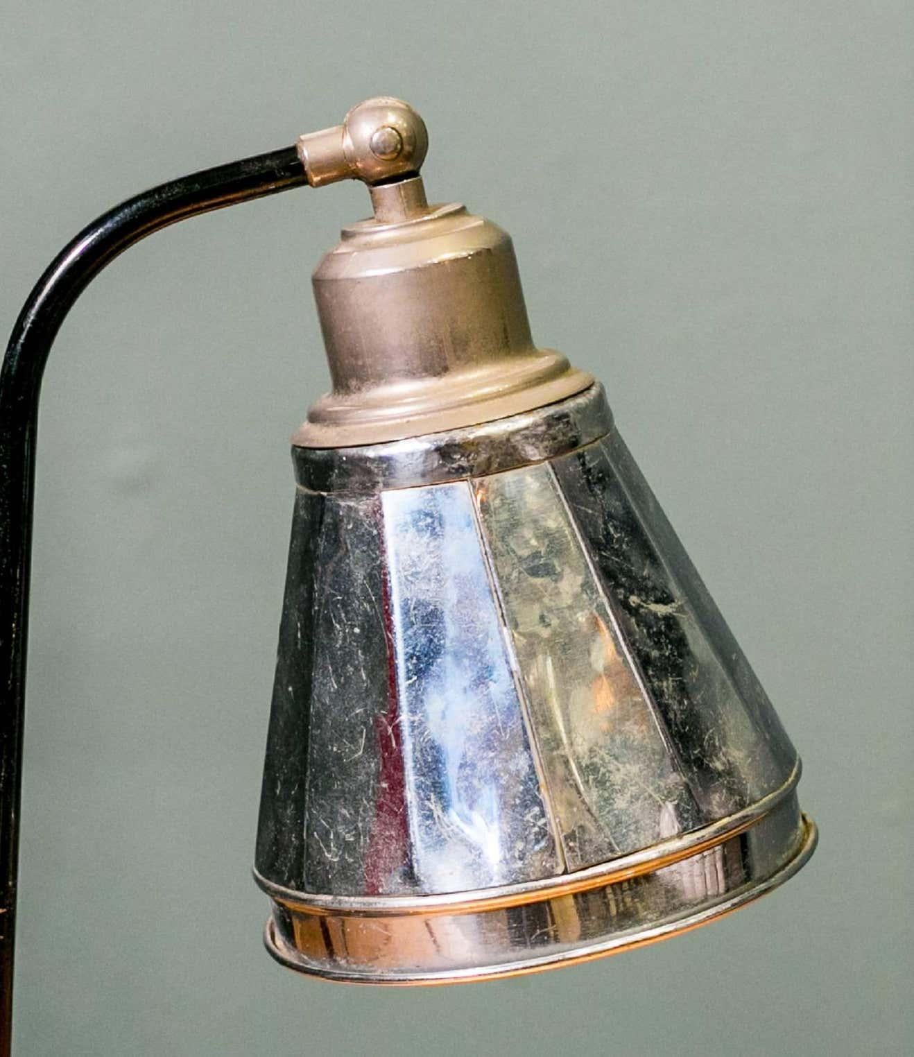 Charming petite vintage table lamp with original on/off toggle on the base and paint. Nickel-plated brass shade is highly reflective. Would make a great desk lamp or bedside lamp. Shade tilts up or down. Newly rewired in the USA with all UL listed