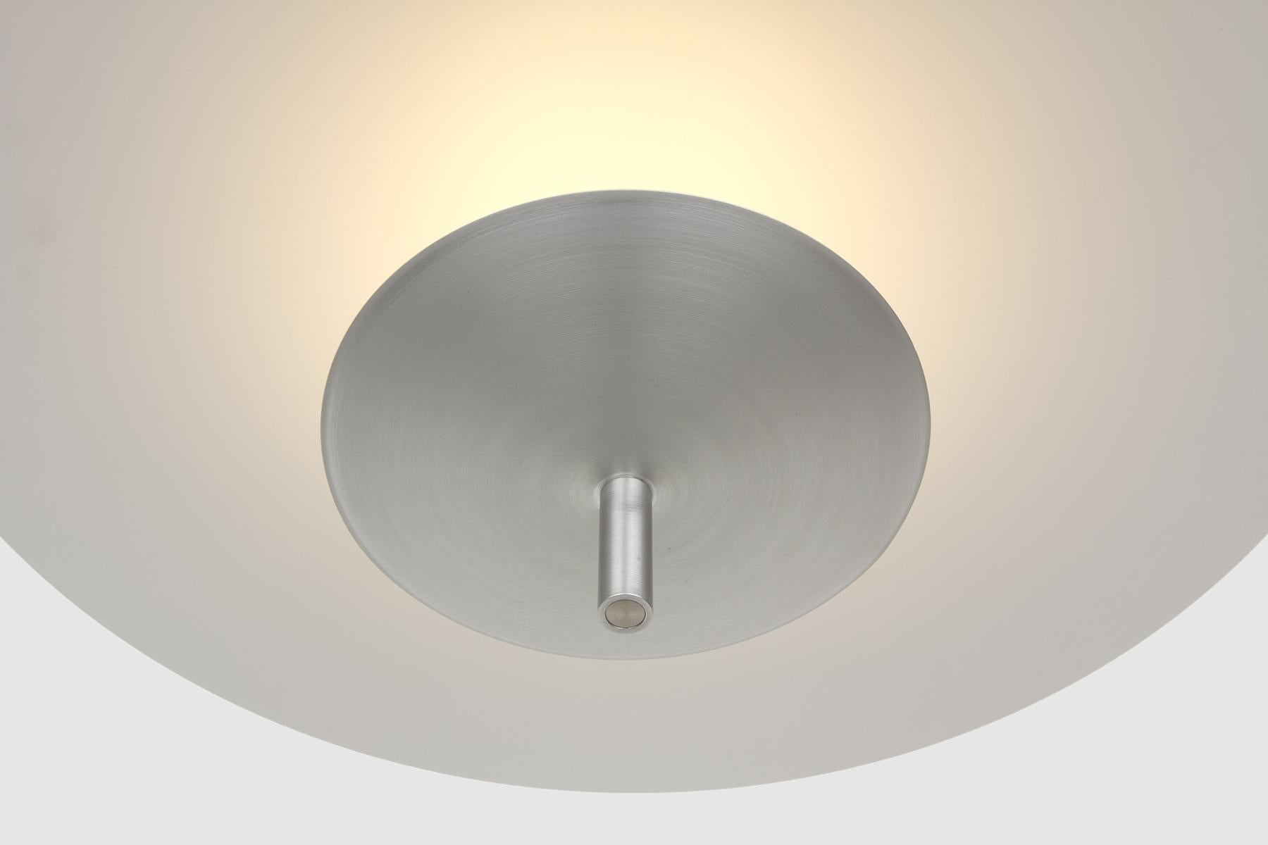 The Reflector pendant is a sophisticated soft lighting option suited for dining tables, workspaces, hallways and other indoor environments that require a diffused and warm lighting experience. 

Light is cast onto a floating reflector, washing the
