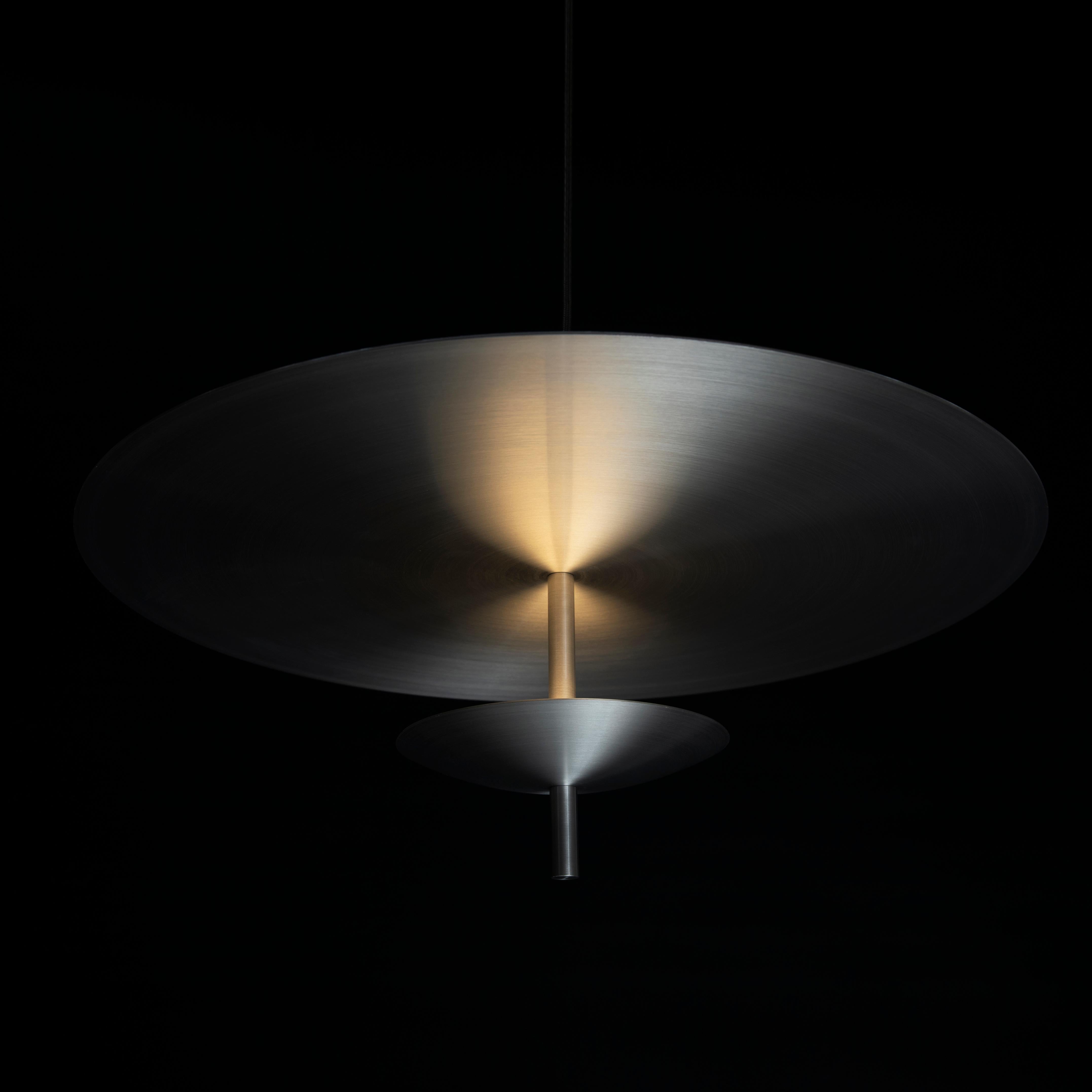 The Reflector pendant is a sophisticated soft lighting option suited for dining tables, workspaces, hallways, and other indoor environments that require a diffused and warm lighting experience. 

Light is cast onto a floating reflector, washing