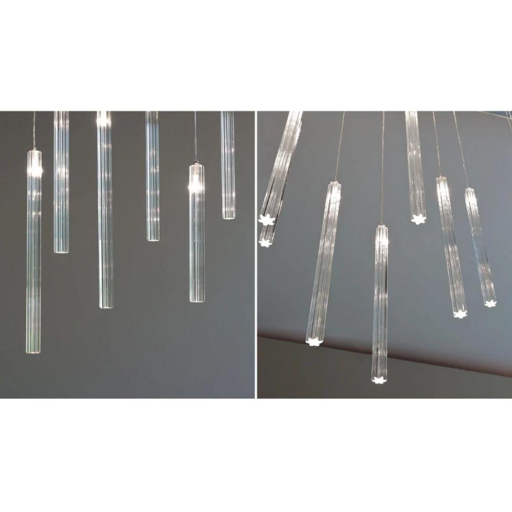 Designed By Studio Reflex

Chandelier with mirror glass support with built-in LED (5W GU5.?3 12V 2700K each).? Pendant elements in transparent glass with LED inside (1,2W G4 12V 2700K).?

Materials: Glass