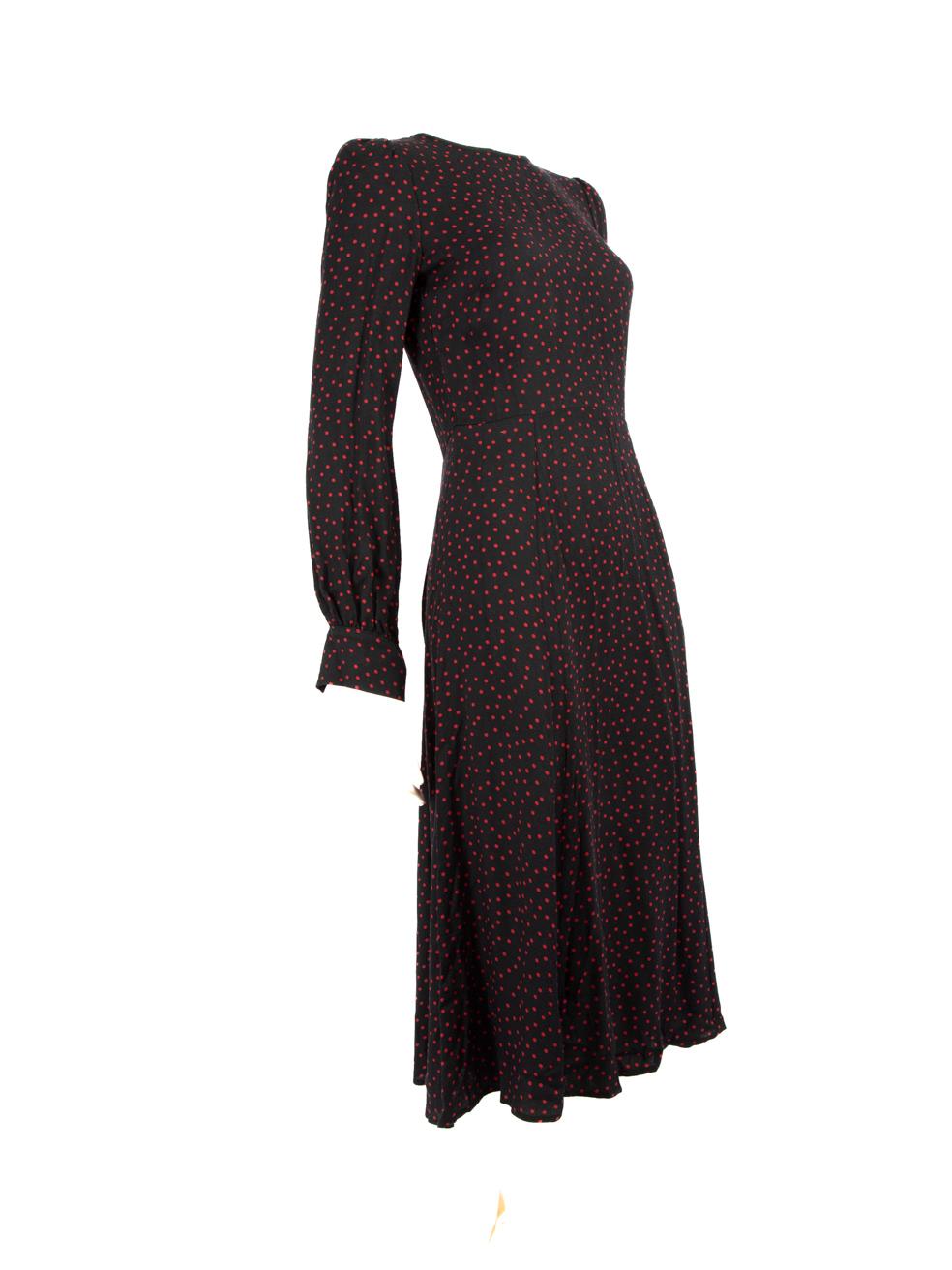 CONDITION is Very good. Minimal wear to dress is evident. Light signs of use, including a pull exposing a white thread which is visible on left shoulder and also stray threads along button holes on this used Reformation designer resale item.

