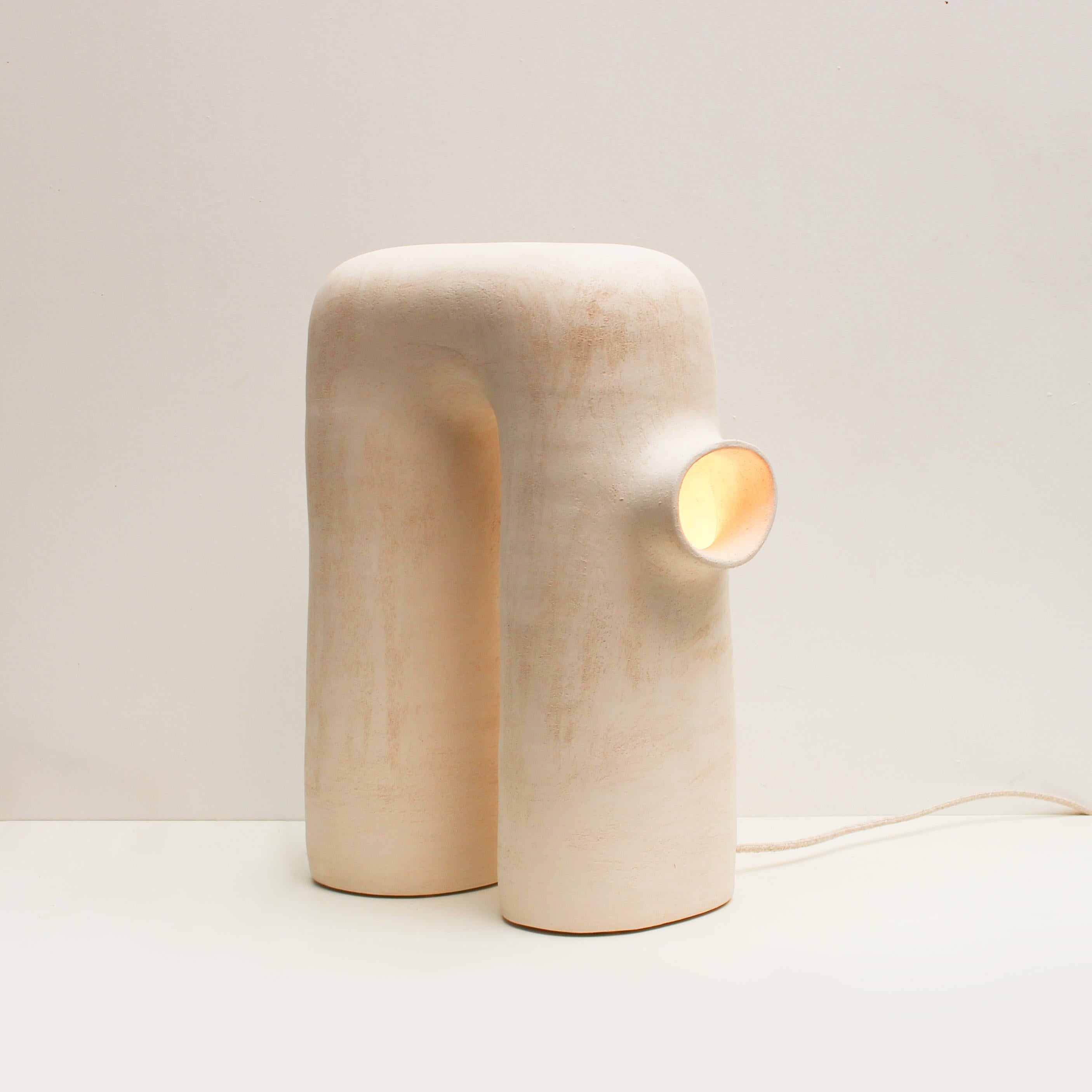 Refuge #14 stoneware lamp by Elisa Uberti
Limited Edition of 4 numbered pieces.
Dimensions: H 50 cm.
Materials: white stoneware.
This product is handmade, dimensions may vary.

After fifteen years in fashion, Elisa Uberti decides to take the