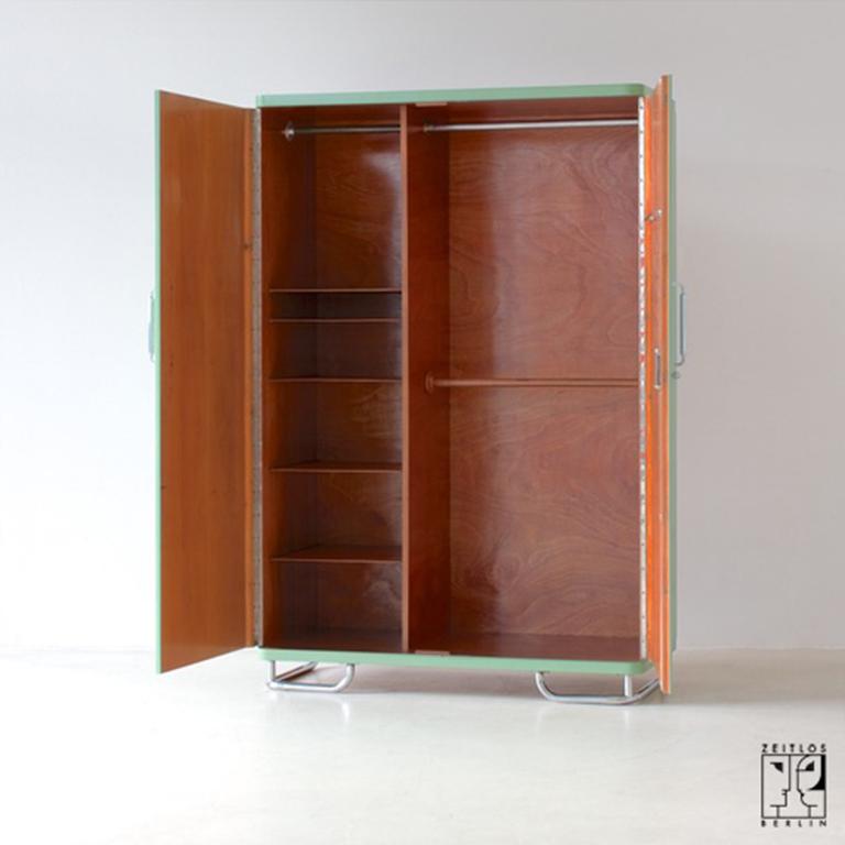 This exquisite Bauhaus wardrobe, crafted in 1929, represents a remarkable example of German craftsmanship. It is characterized by its minimalist and functional design, typical of the Bauhaus style. Made from high-quality materials, it features a