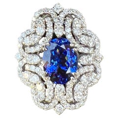 Regal 12.10 Carat AAAA Intense Blue Tanzanite and Diamond 18K Ring