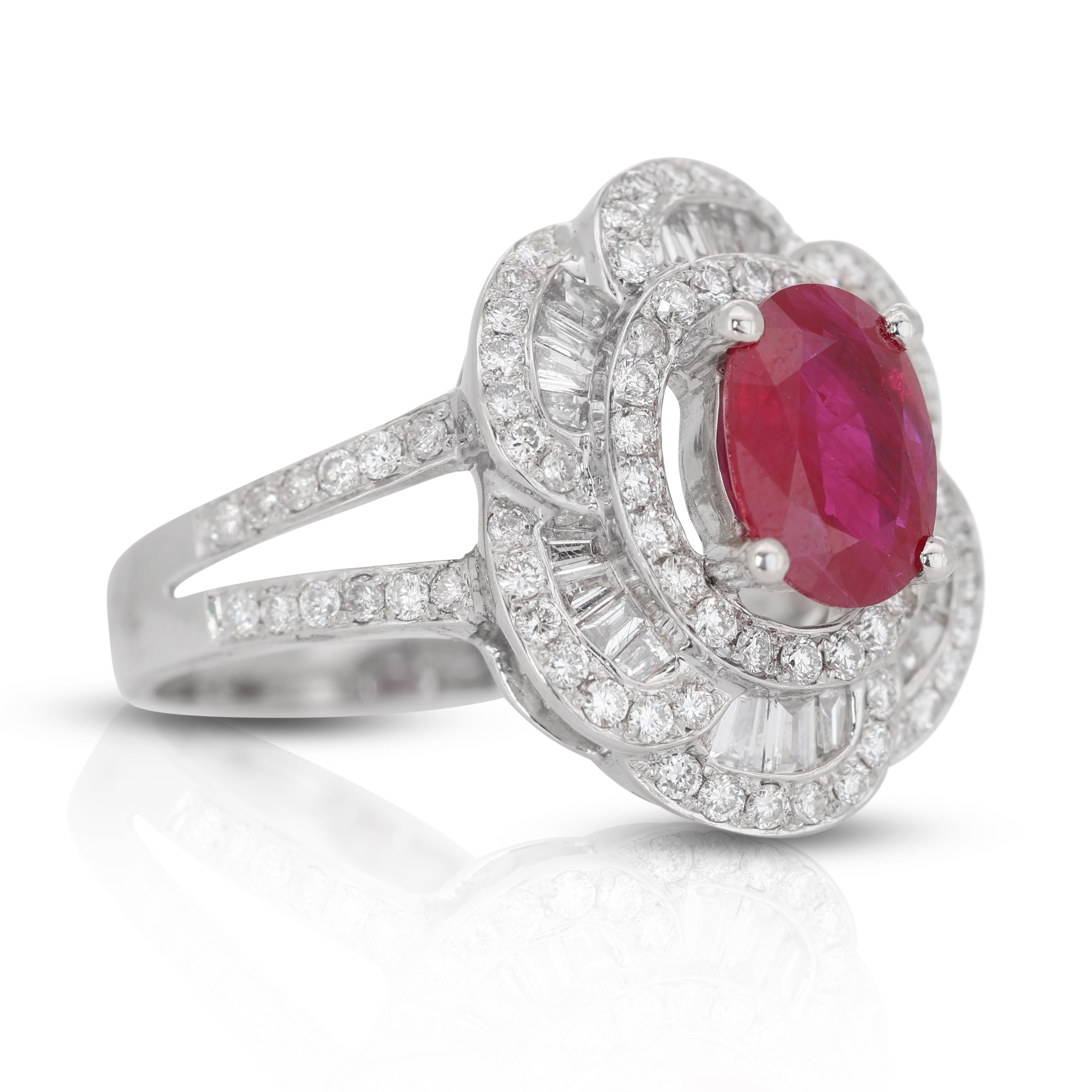 Regal 18k White Gold Ruby and Diamond Double Halo Ring w/2.36 ct - IGI Certified

Introducing this 18k White Gold Double Halo Ring that exudes sophistication and a timeless appeal. At the centerpiece of this luxurious ring is a stunning 1.21 ct oval