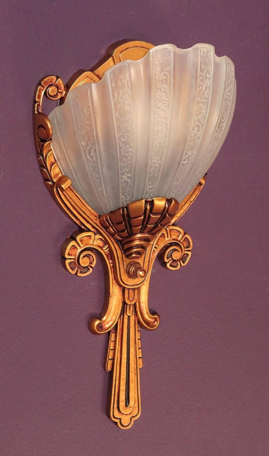 Only 4 available, priced each.
Beautiful with the light bulb on or off.
Elegant and stately vintage Art Deco era wall sconces from the 1930s. Their well-executed detailed design and inherent beauty spans numerous genres of architectural styles to