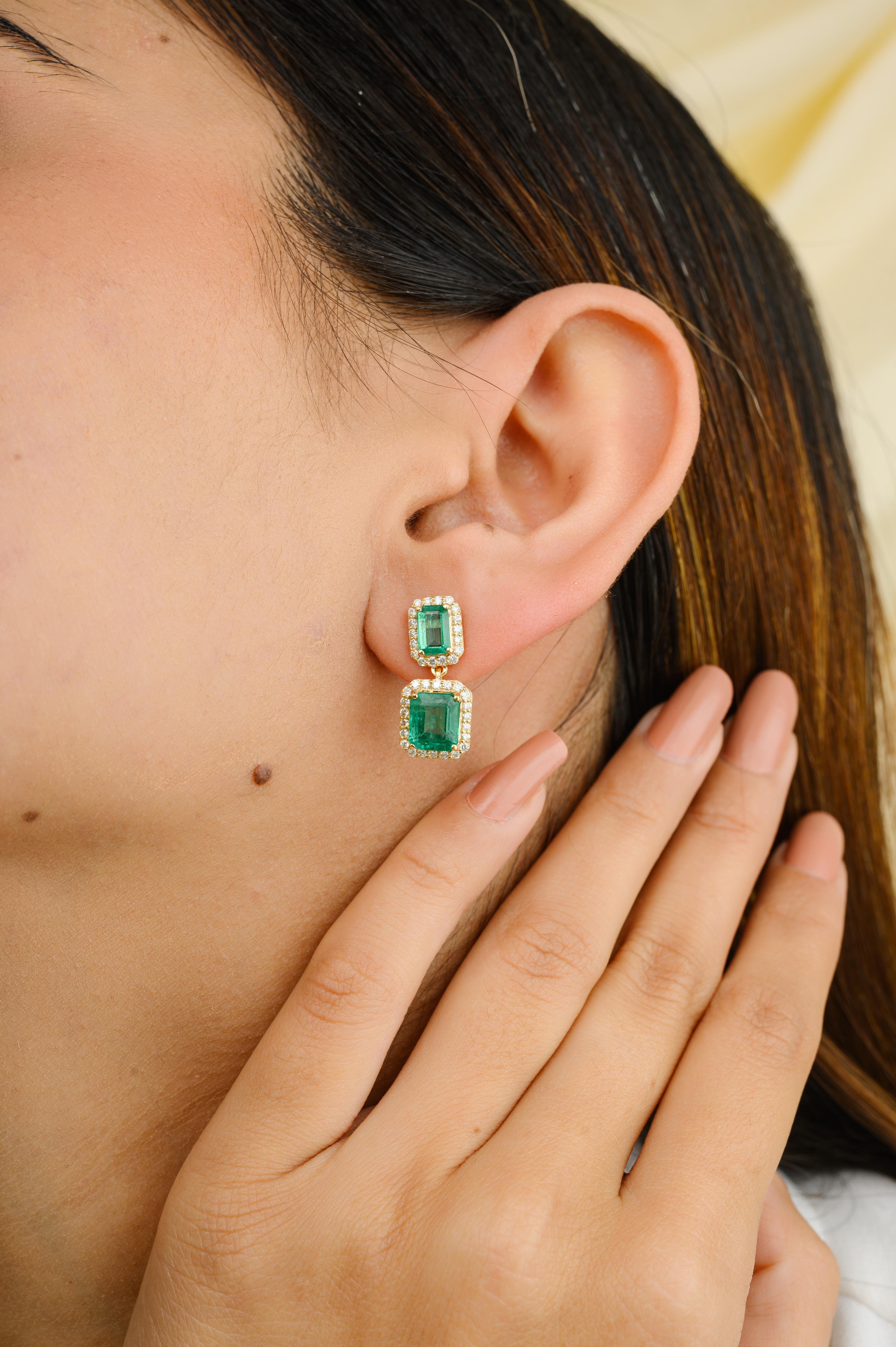 Regal Emerald and Diamond Engagement Dangle Earrings in 18K Gold to make a statement with your look. You shall need dangle earrings to make a statement with your look. These earrings create a sparkling, luxurious look featuring octagon cut emerald
