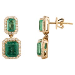 Regal Emerald and Diamond Halo Engagement Dangle Earrings in 18k Yellow Gold