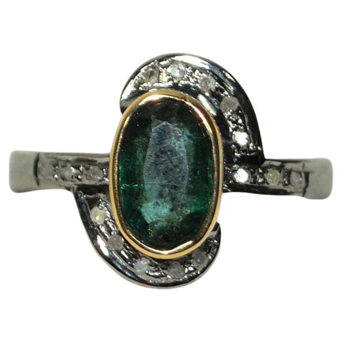 This stunning ring is one of its kind.
It consists of:
Diamond- Natural rose cut diamond
Diamond color- Tinted grey
Metal- Silver
Metal purity- 925 silver or sterling silver
Gemstone- emerald (Natural)
Gemstone origin- Zambia