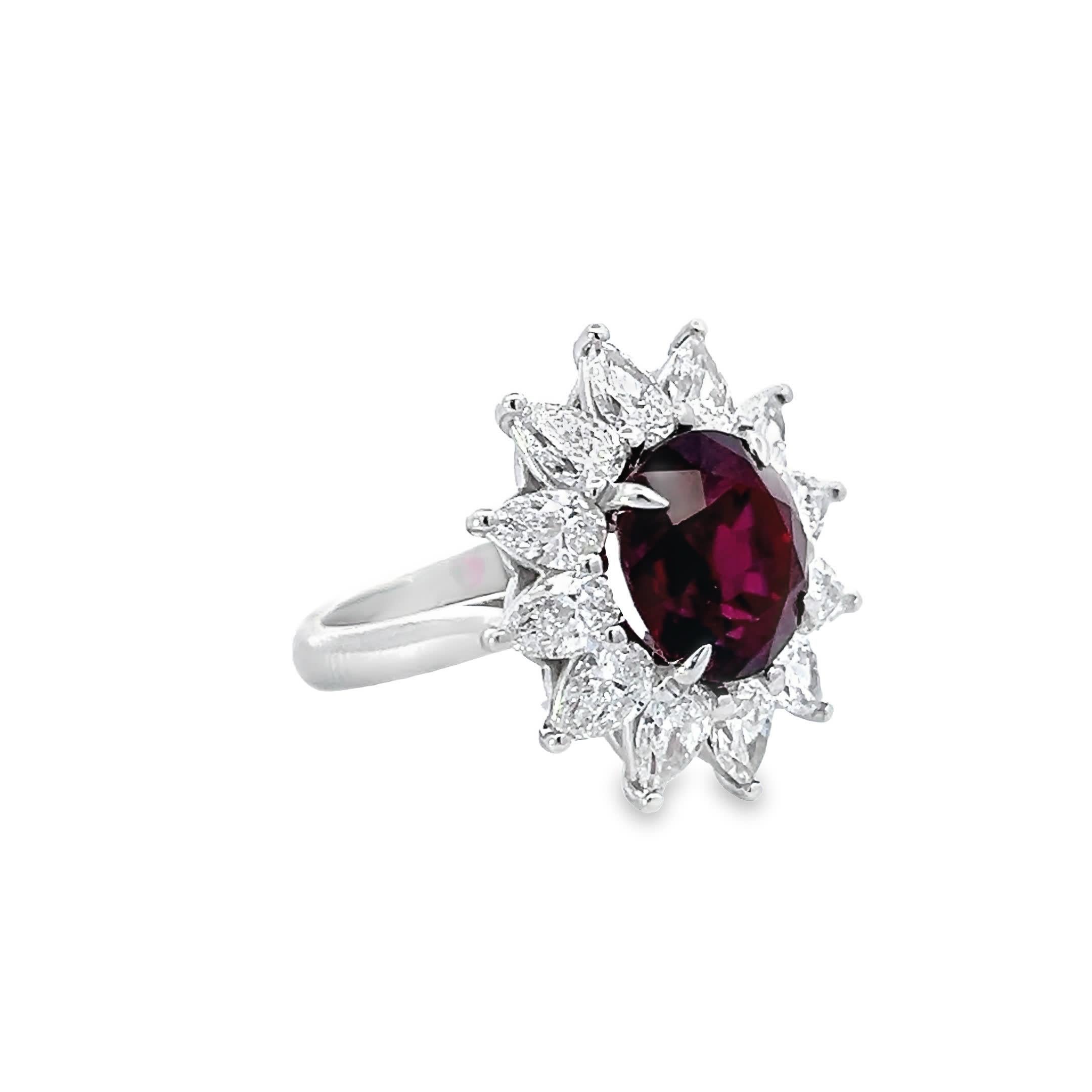 Embrace the elegance of royalty with this exquisite ruby ring, surrounded by a radiant halo of diamonds that create a spectacular sunburst effect. Perfect for those special occasions where you want to stand out.