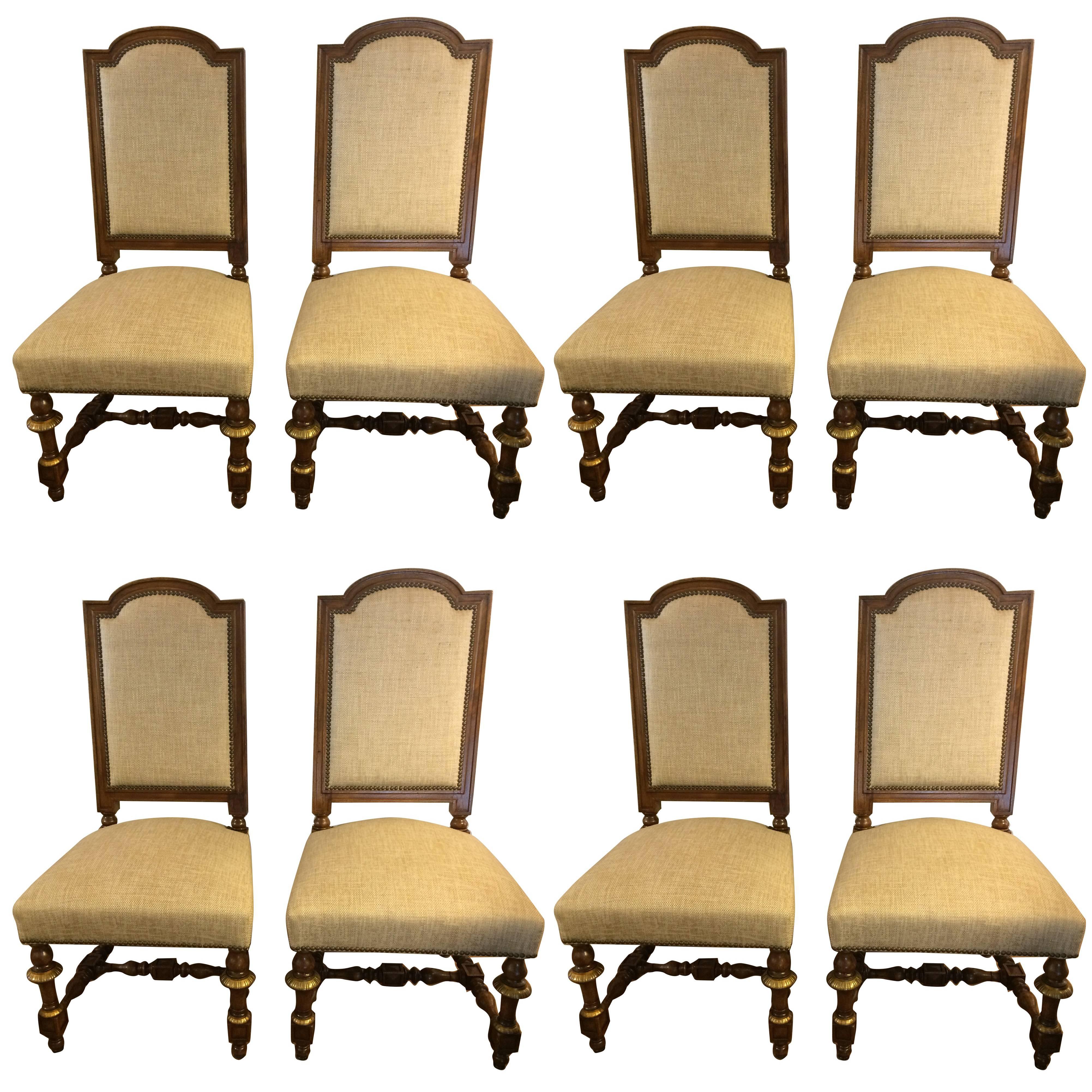 Regal Set of Eight Early French Carved Walnut and Bronze Gilded Dining Chairs