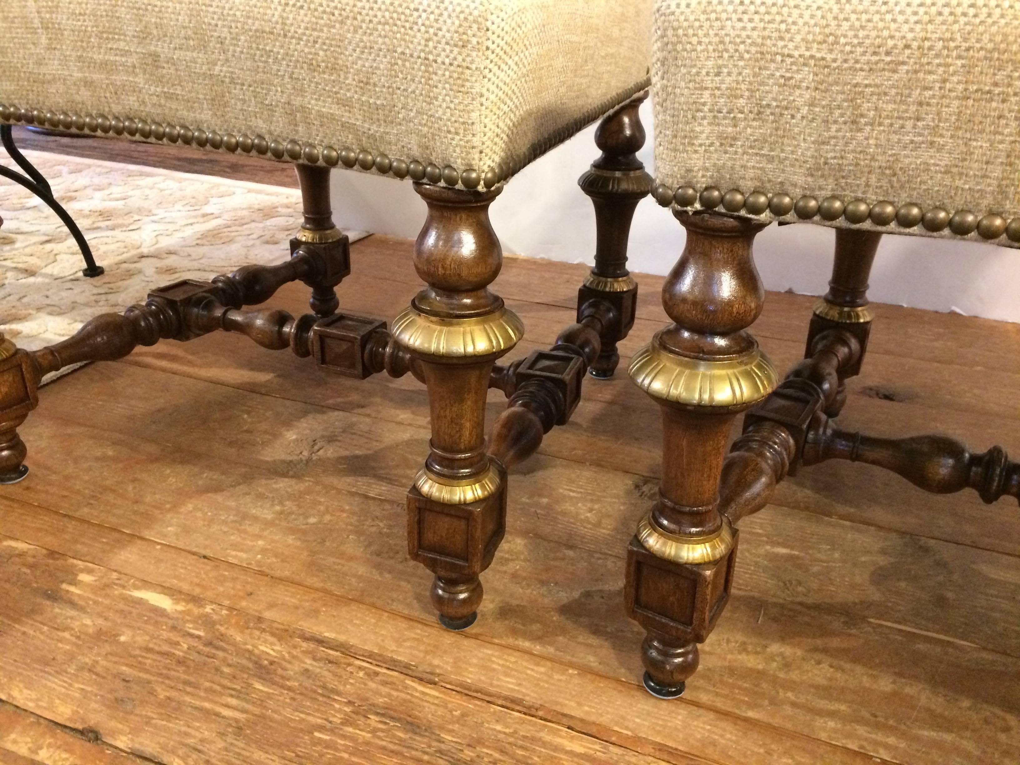 Regal Set of Eight Early French Carved Walnut and Bronze Gilded Dining Chairs 1