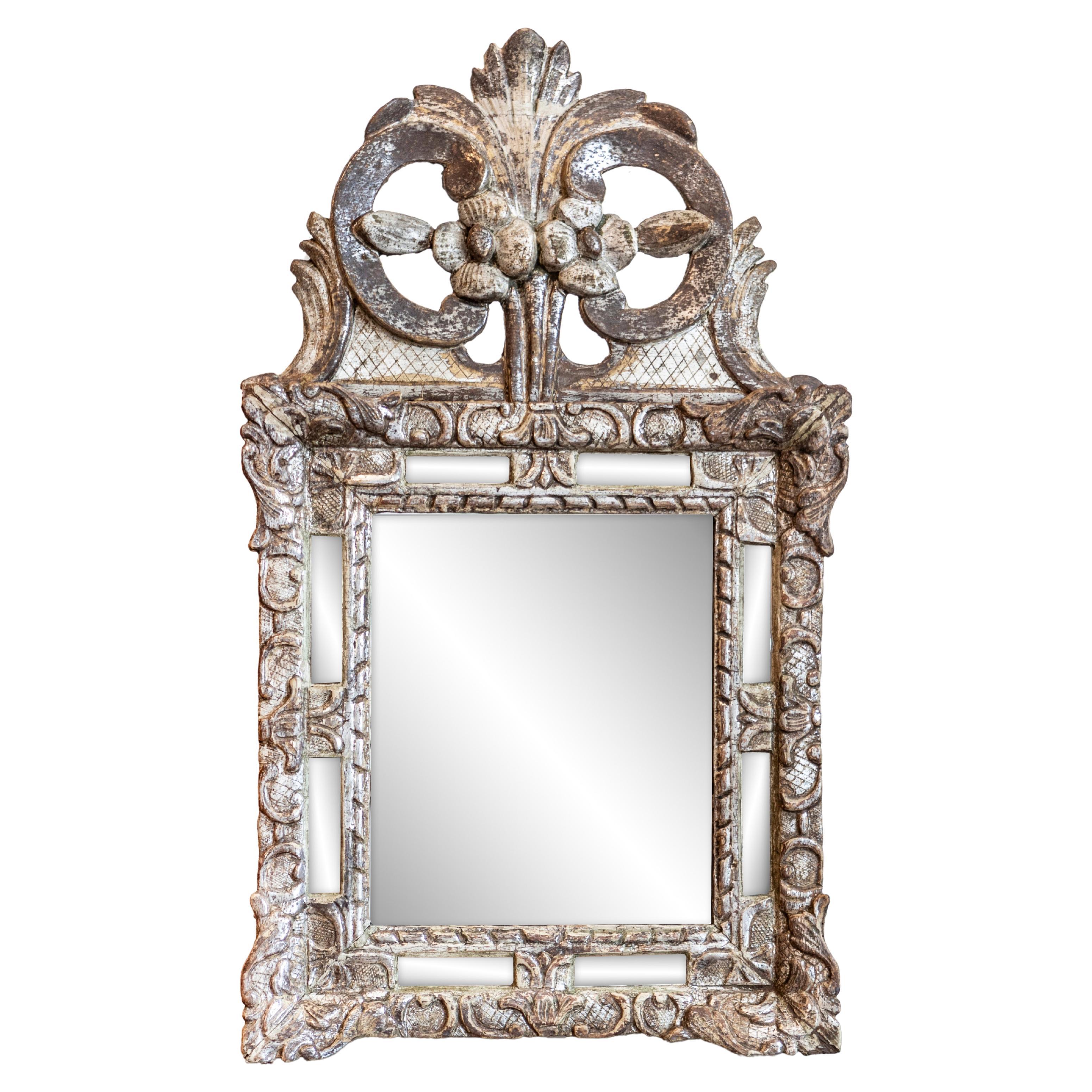 Régence 18th Century French Silver Parcel Gilt Mirror with Floral Carved Crest For Sale