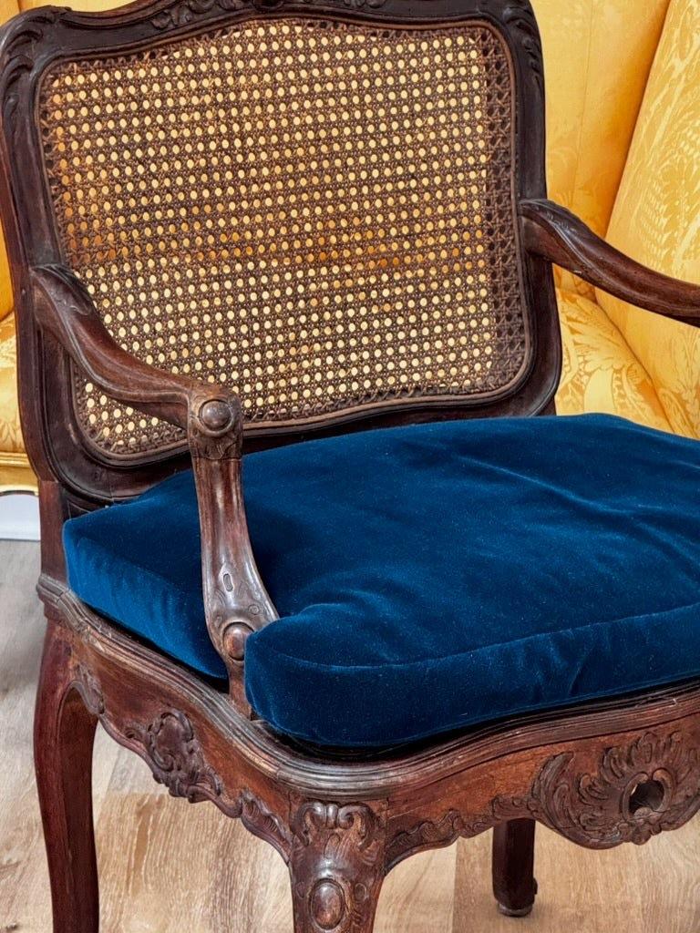 French Regence Beechwood Caned Fauteuil, France, 18th century For Sale
