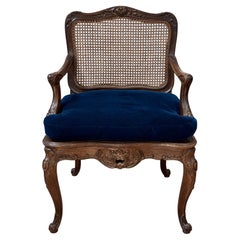 Regence Beechwood Caned Fauteuil, France, 18th century
