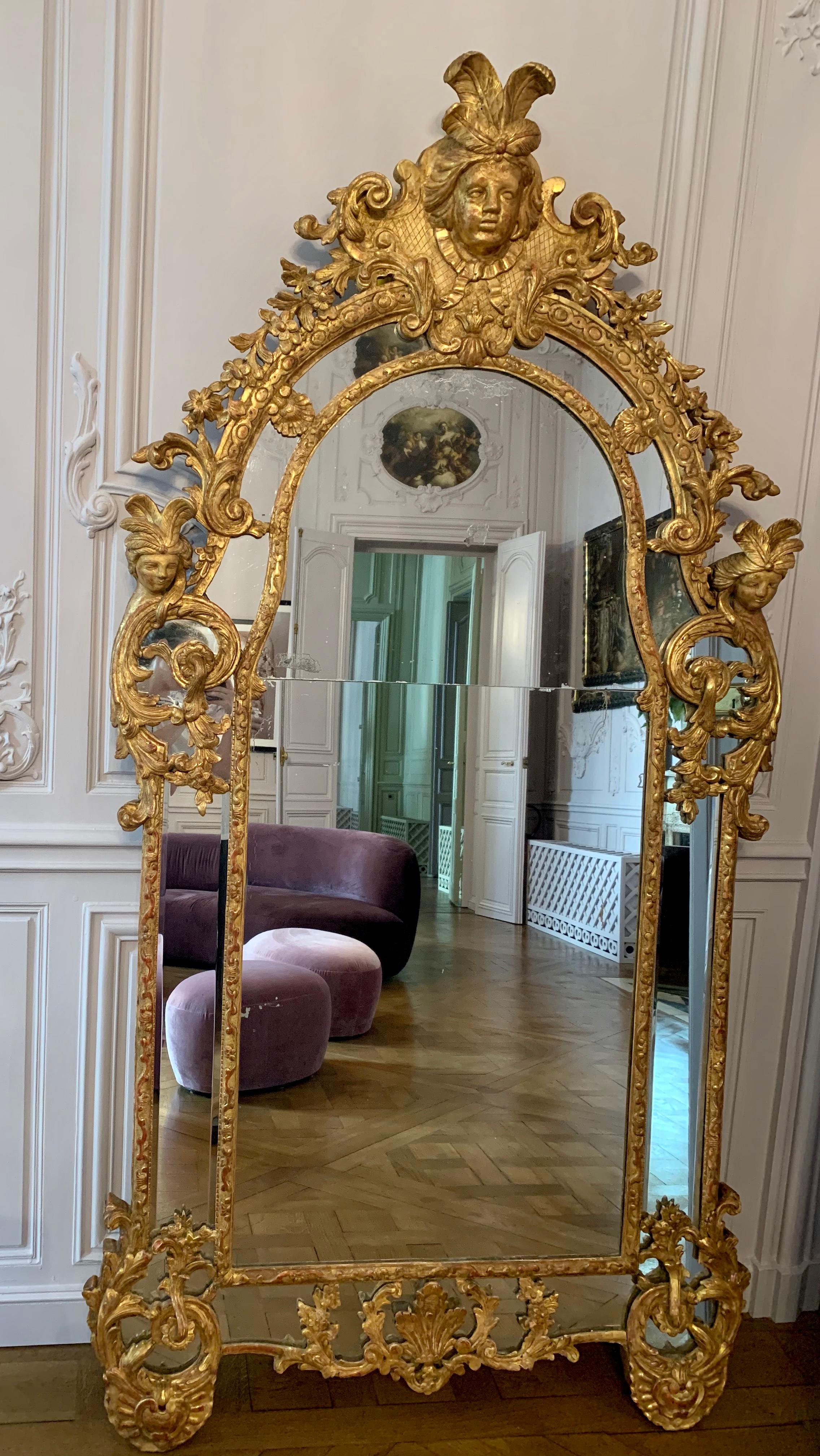 A beautiful and large Regence gilt-beechwood mirror, circa 1720, in beautiful conditions. From a unique private mansion in Switzerland, re-designed in 2005-2007 by François-Joseph Graf.

The Régence was the period in French history between 1715 and