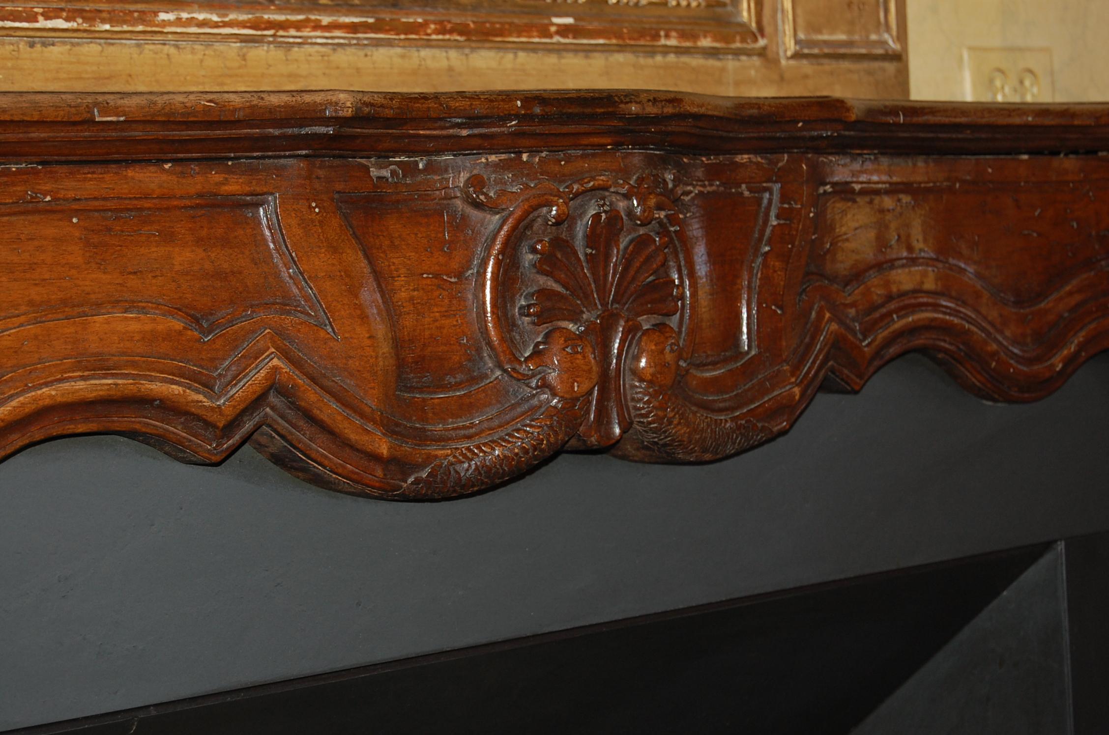 18th Century Régence Period Carved Walnut Serpentine Fireplace Mantel, circa 1715 For Sale