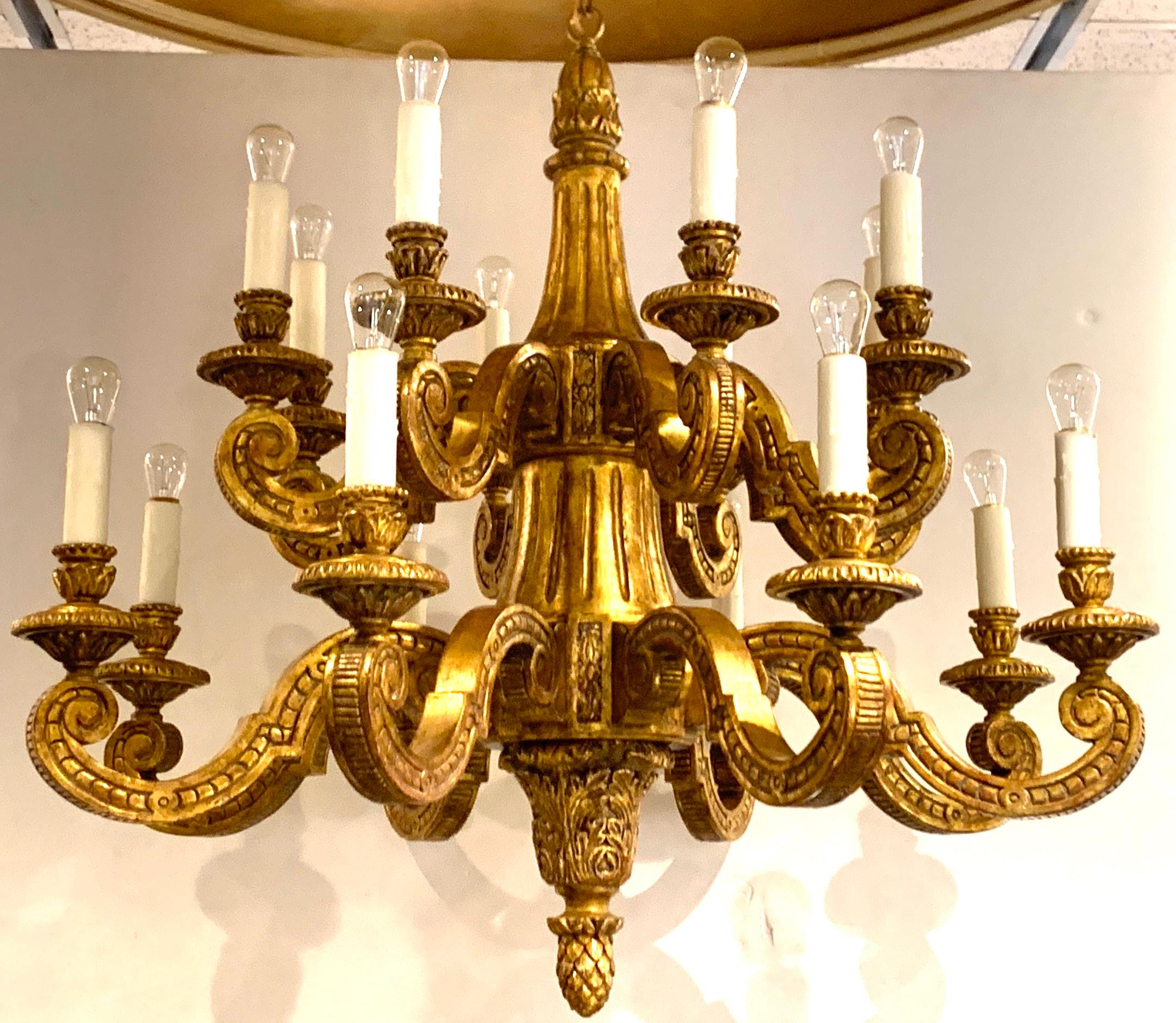 Regence style carved giltwood chandelier, 18 lights, two tiers nicely carved with fine details, fitted with 18 standard bulbs

Measures: 36